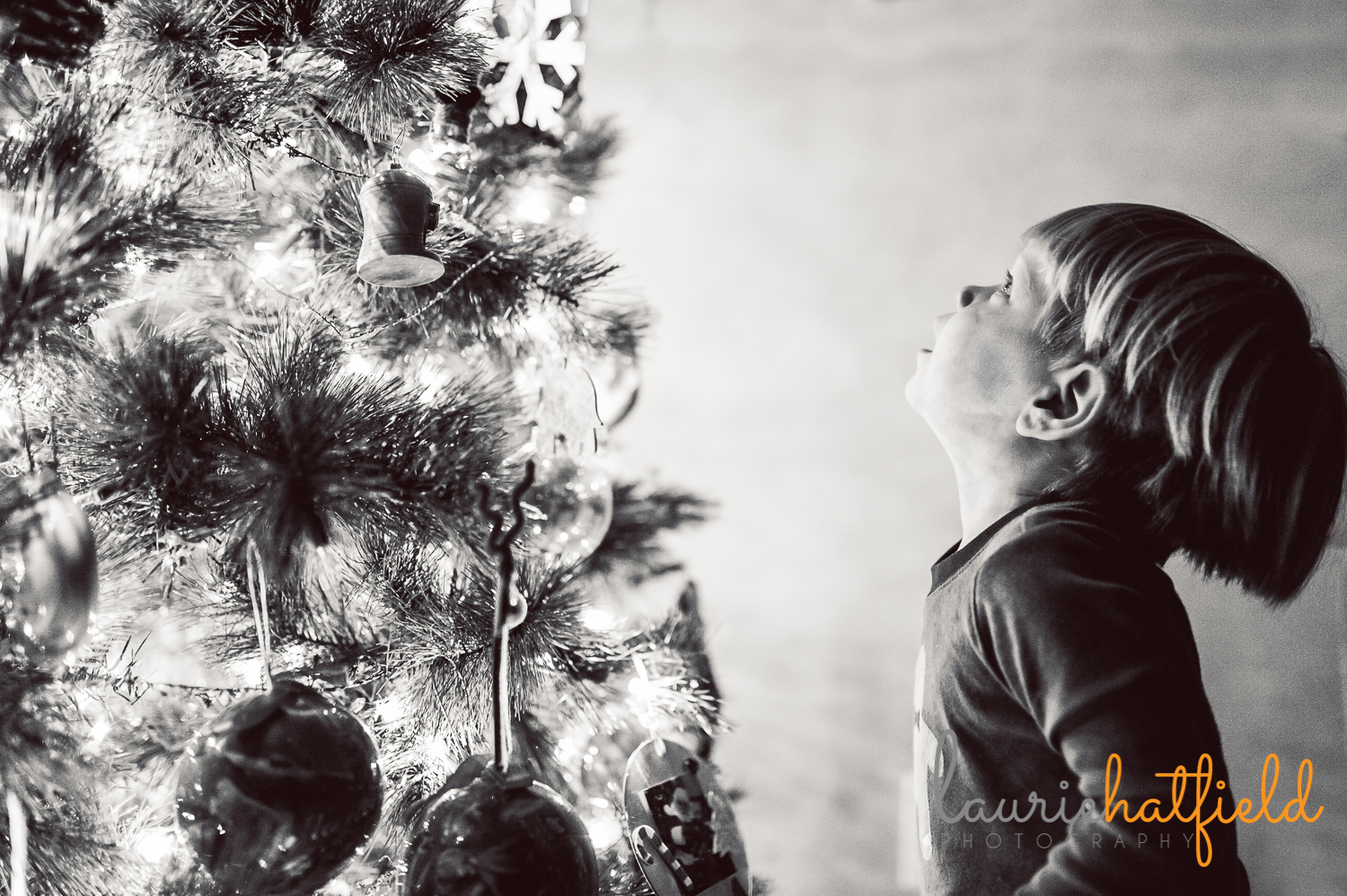kids by the Christmas tree
