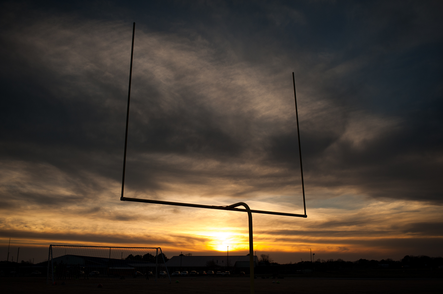 silhouette of football goalpost at sunset | huntsville family photographer