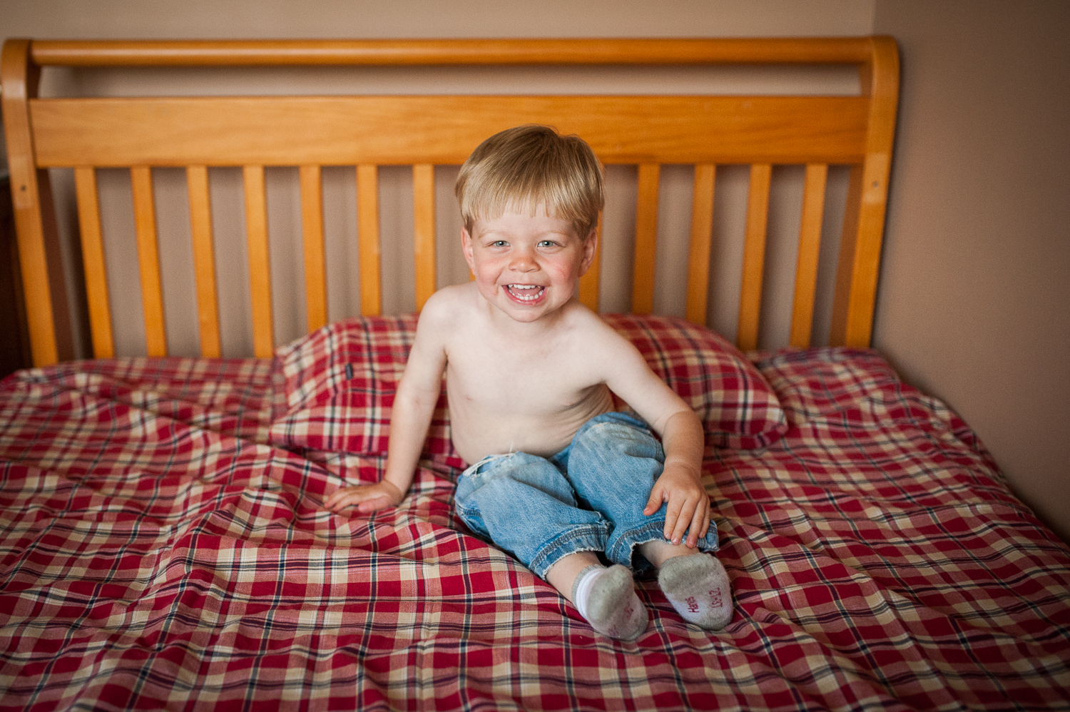 little boy sitting on bed | Huntsville family photographer