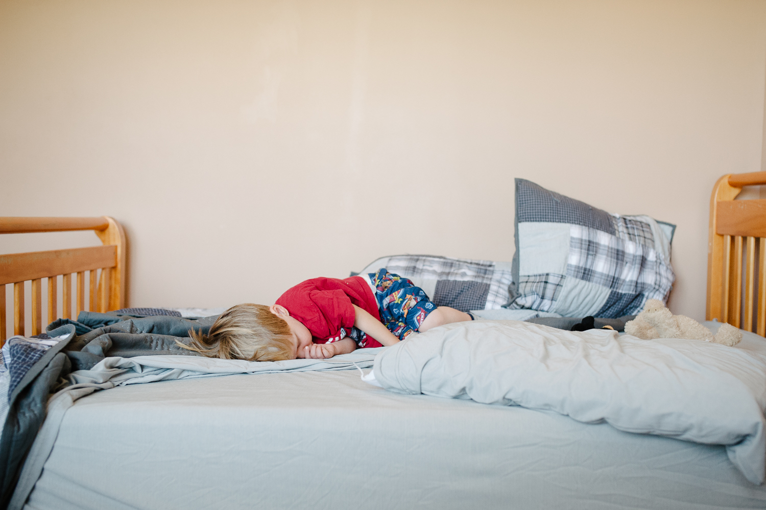 little boy sleeping in big bed | Huntsville photographer