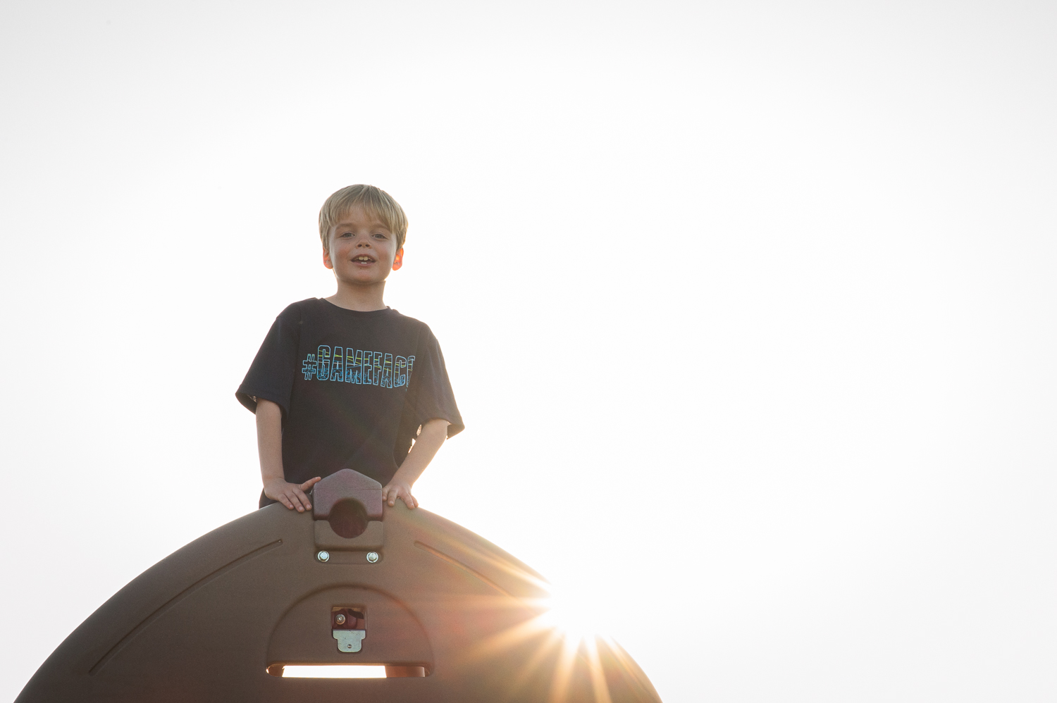 little boy on top of play set | Huntsville family photographer