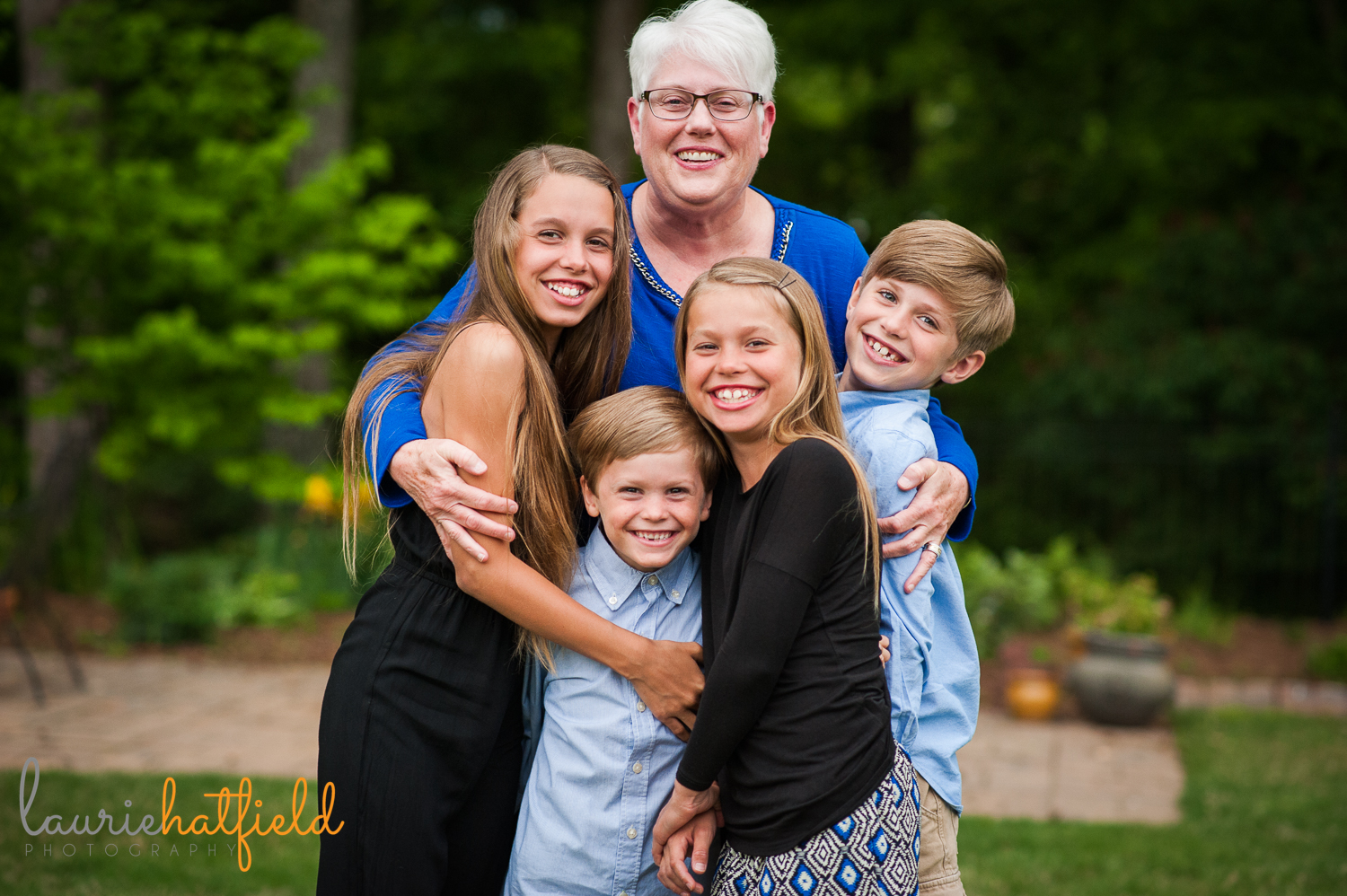 grandmother hugging 4 grandchildren | Huntsville photographer