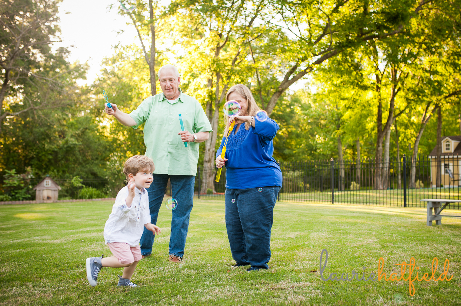 grandparents blowing bubbles with grandson | Huntsville photographer