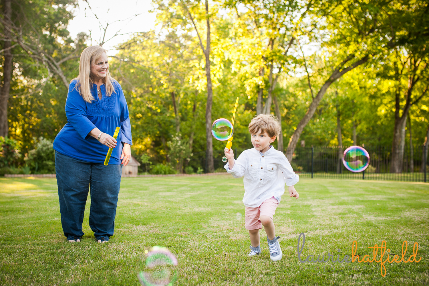 grandparents blowing bubbles with grandson | Huntsville mini sessions