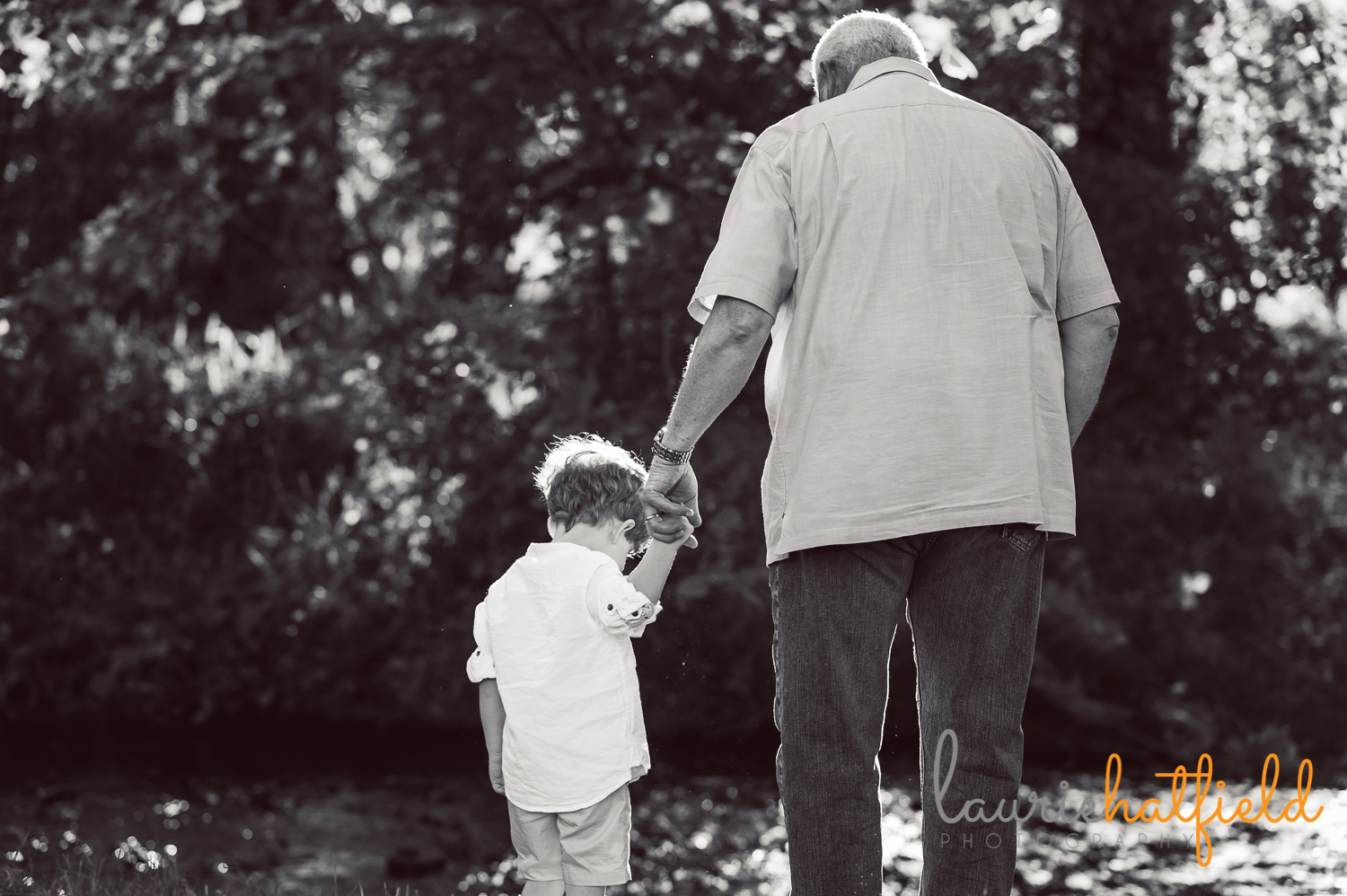 grandfather holding hands with grandson | Huntsville family photographer