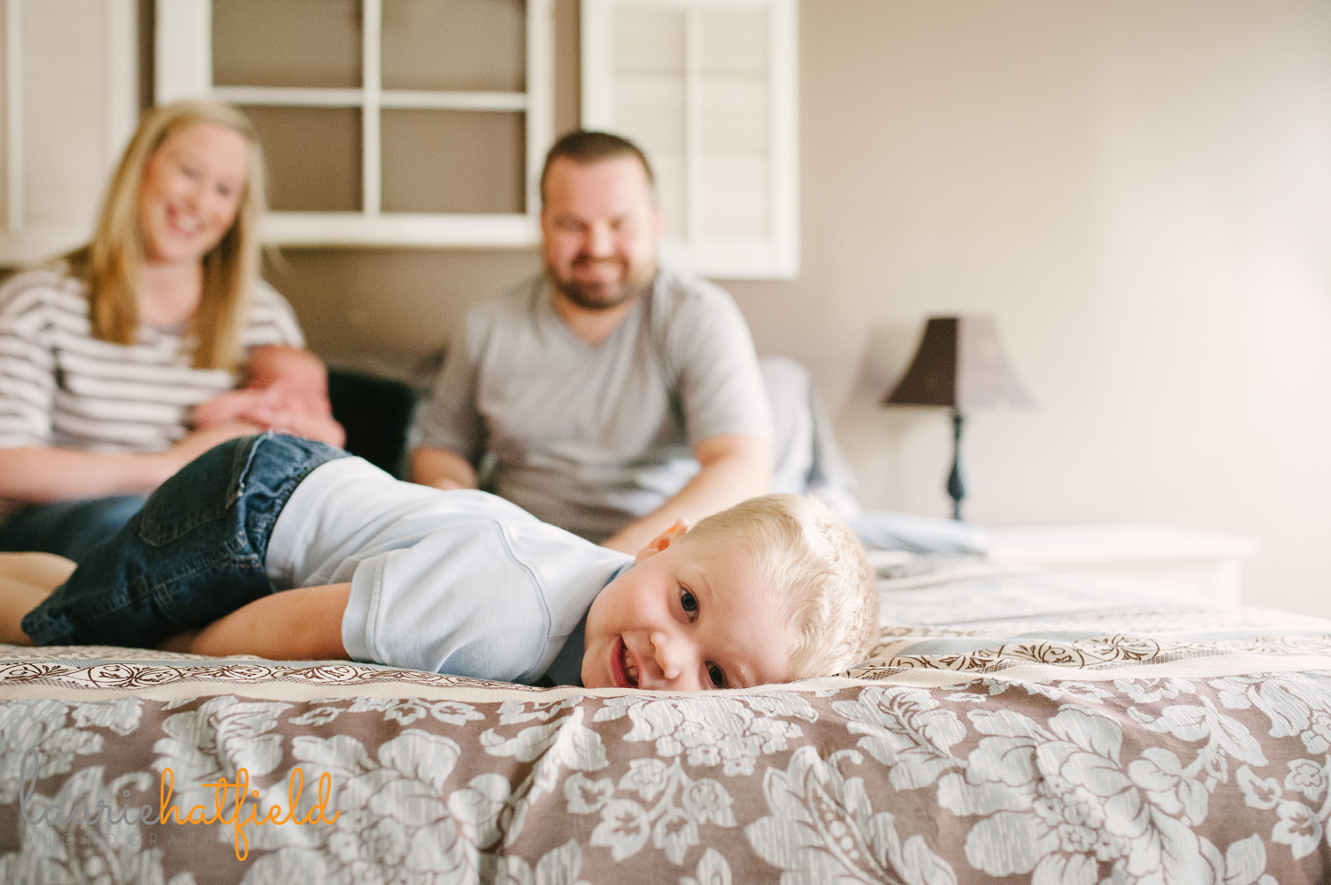 big brother peeking at edge of bed | Huntsville AL newborn photographer