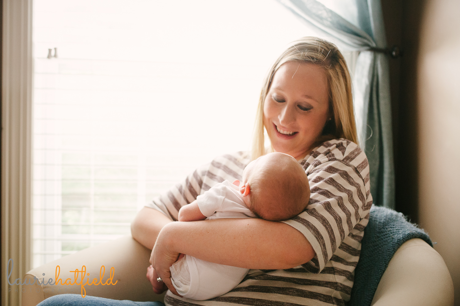 mom sitting and holding new baby | Huntsville AL newborn photos