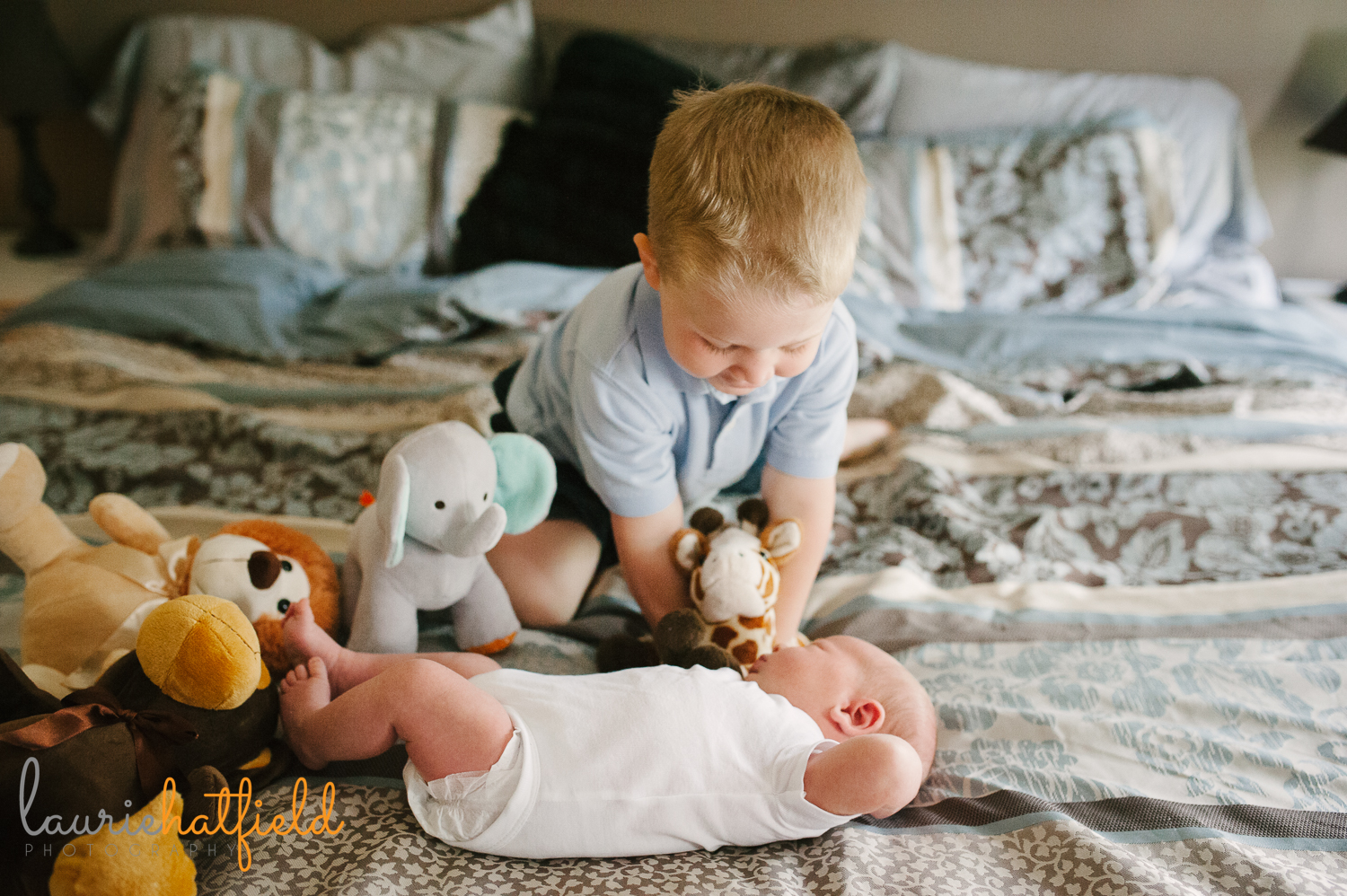 big brother playing with new baby | Huntsville newborn photographer