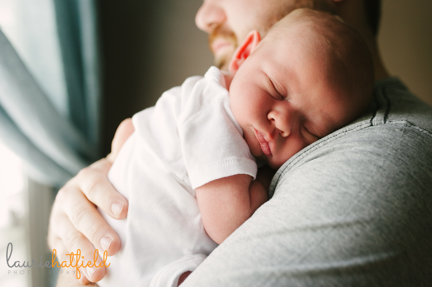 dad holding new baby boy | Huntsville newborn photographer