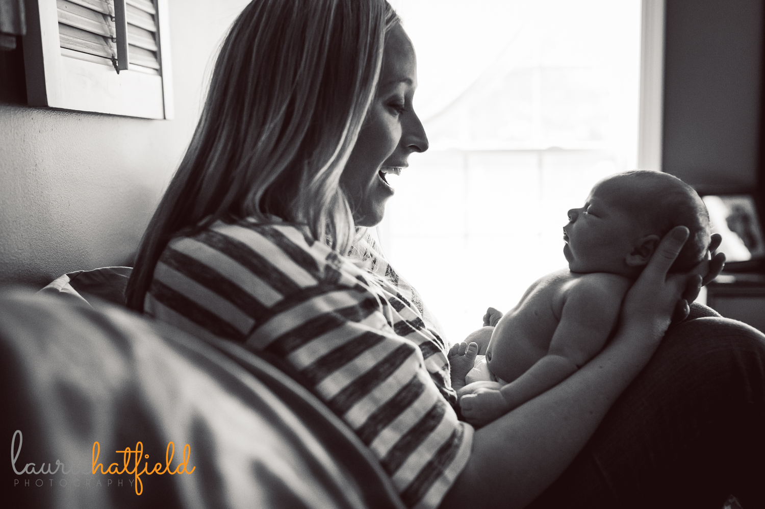 mom holding new baby boy | Huntsville family photographer
