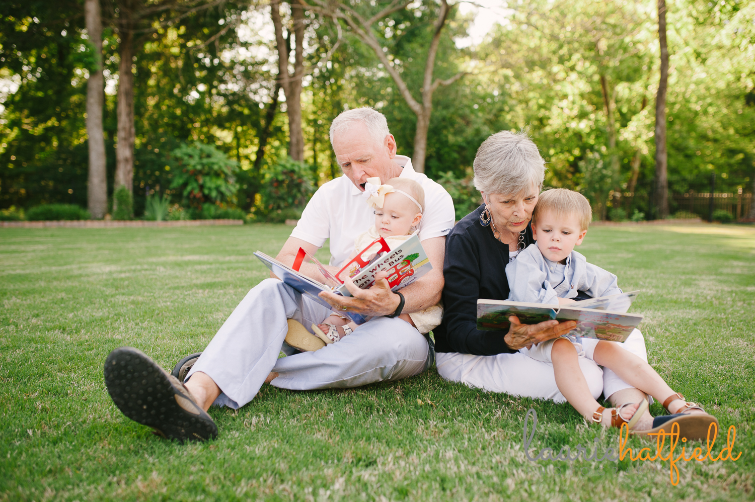 grandparents reading on lawn with grandchildren | Huntsville family photographer