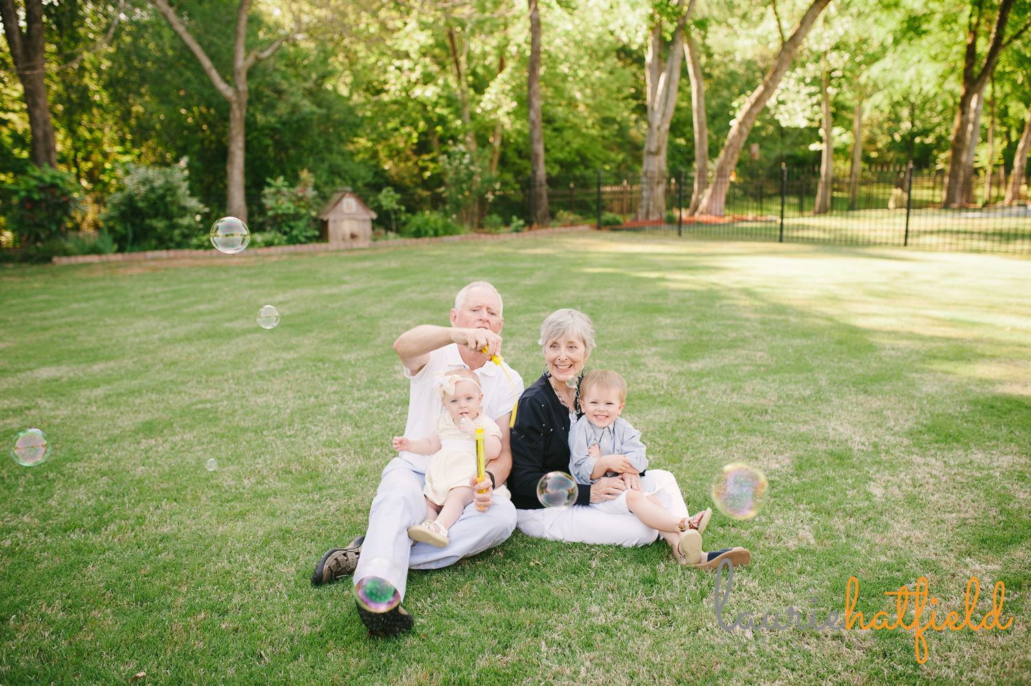 grandparents blowing bubbles with grandchildren | Huntsville photographer