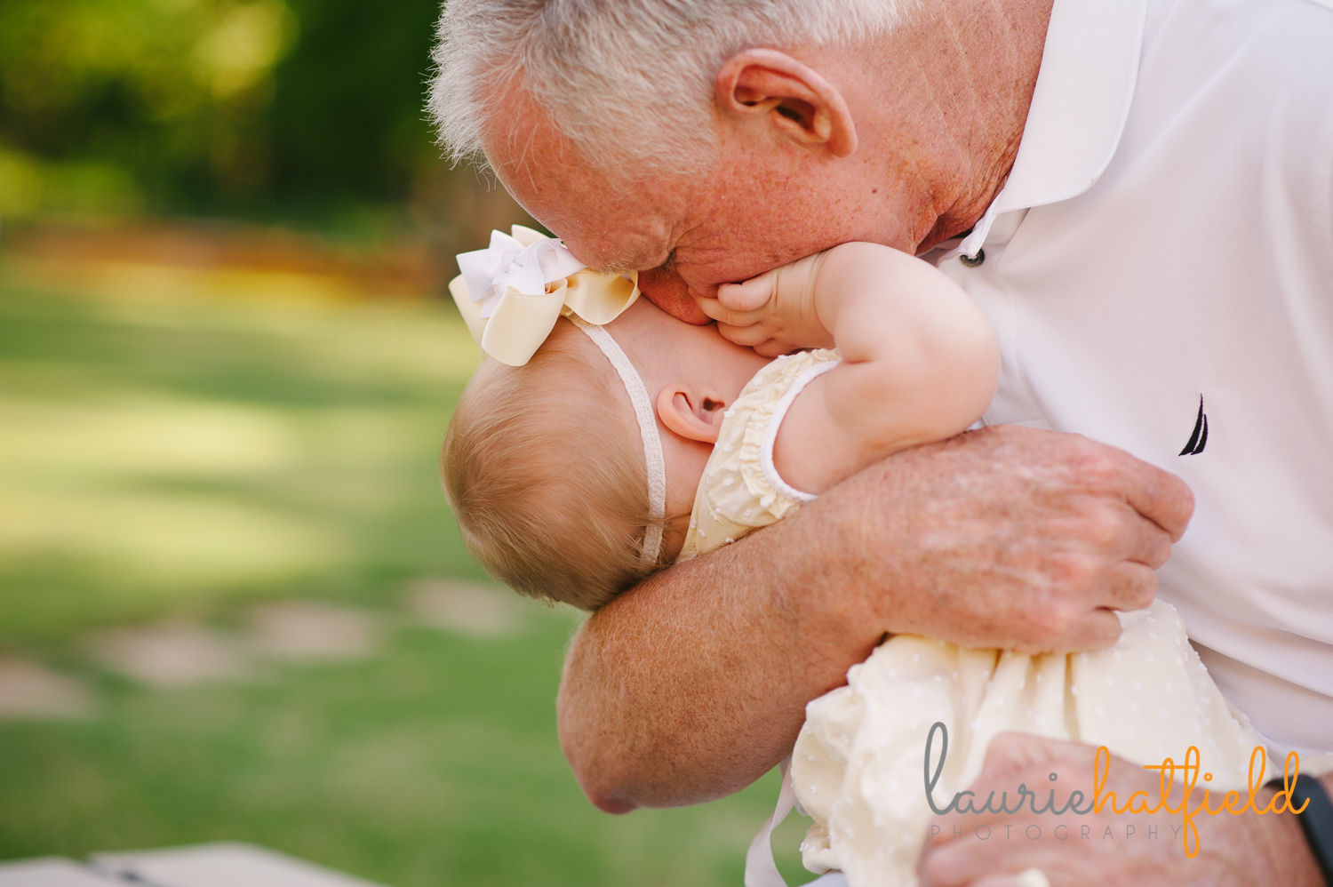 grandfather kissing baby granddaughter | Huntsville photographer
