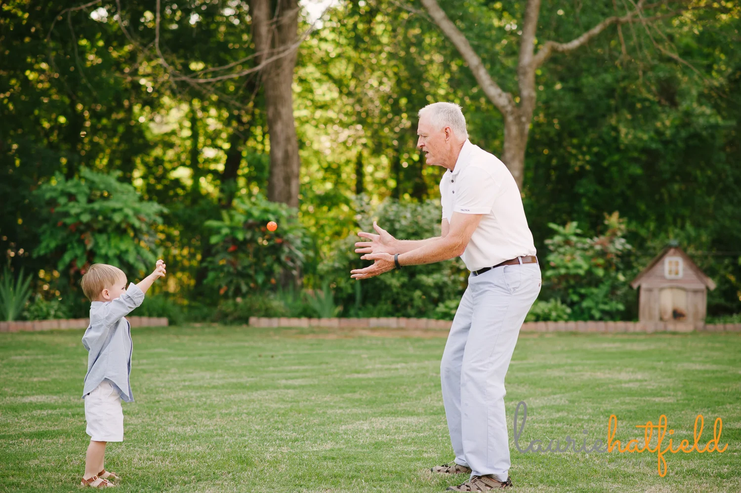grandfather playing catch with 3-year-old grandson | Huntsville family photographer