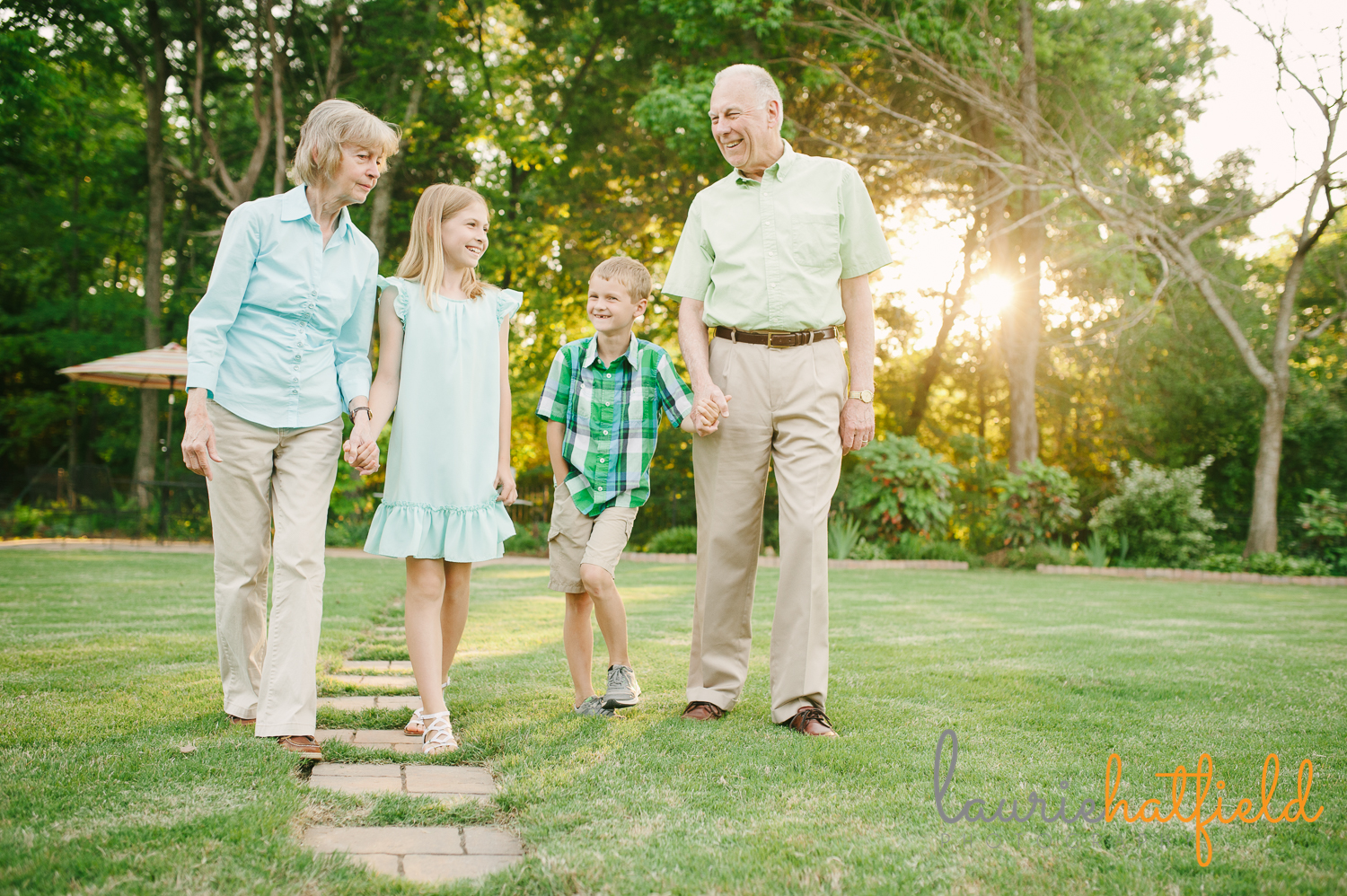 grandparents walking with granddaughter and grandson | Huntsville family photographer