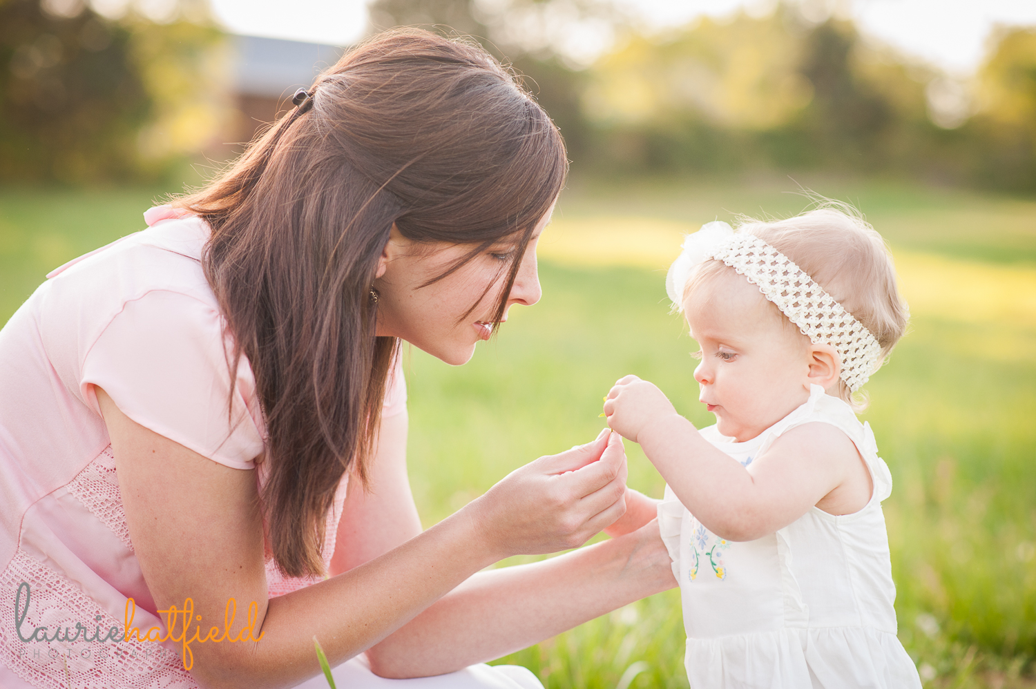 baby girl picking flowers with mom | Huntsville family photographer