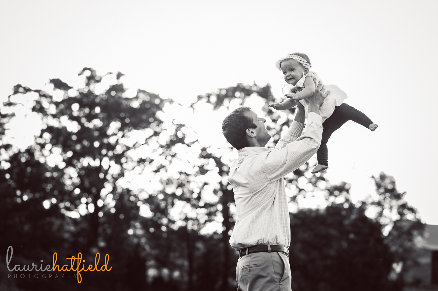dad tossing baby in air | Huntsville photographer