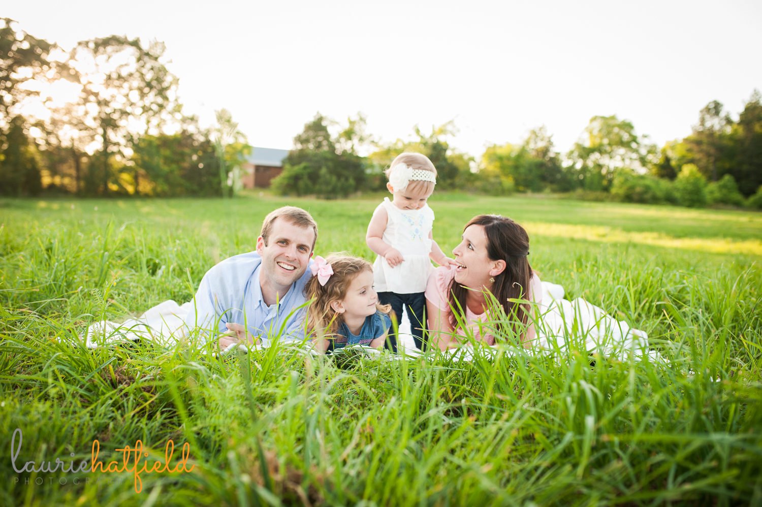 family of four on blanket in grass | Huntsville photographer