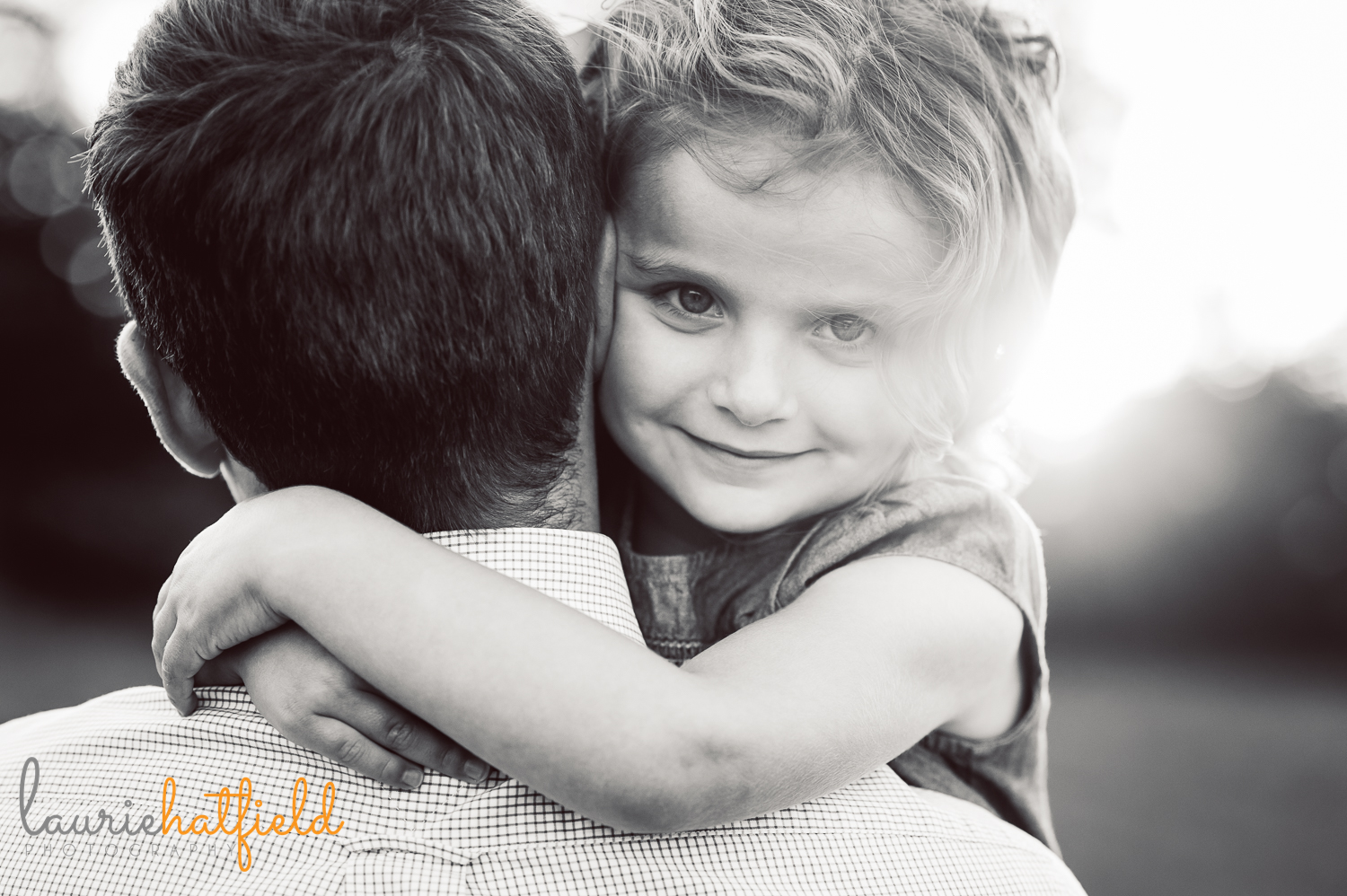 girl peeking over dad's shoulder | Huntsville child photographer