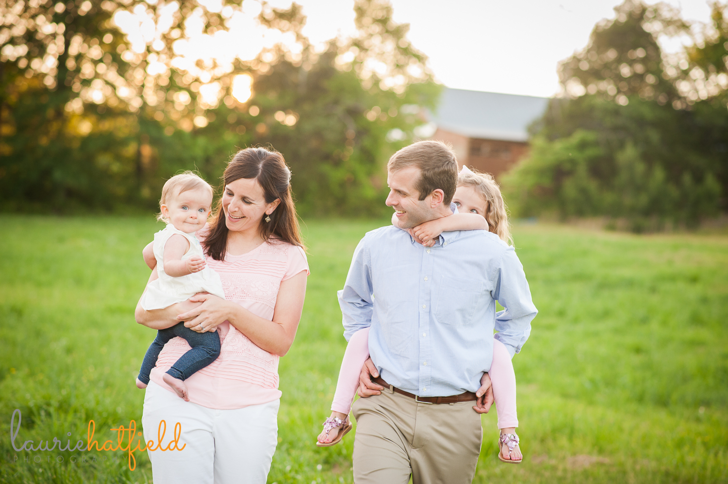 family of four walking in grass | Huntsville photographer