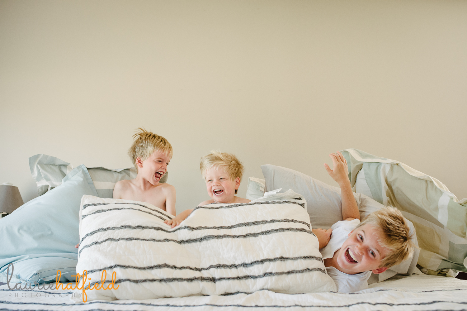 3 brothers playing on bed | Huntsville family photographer