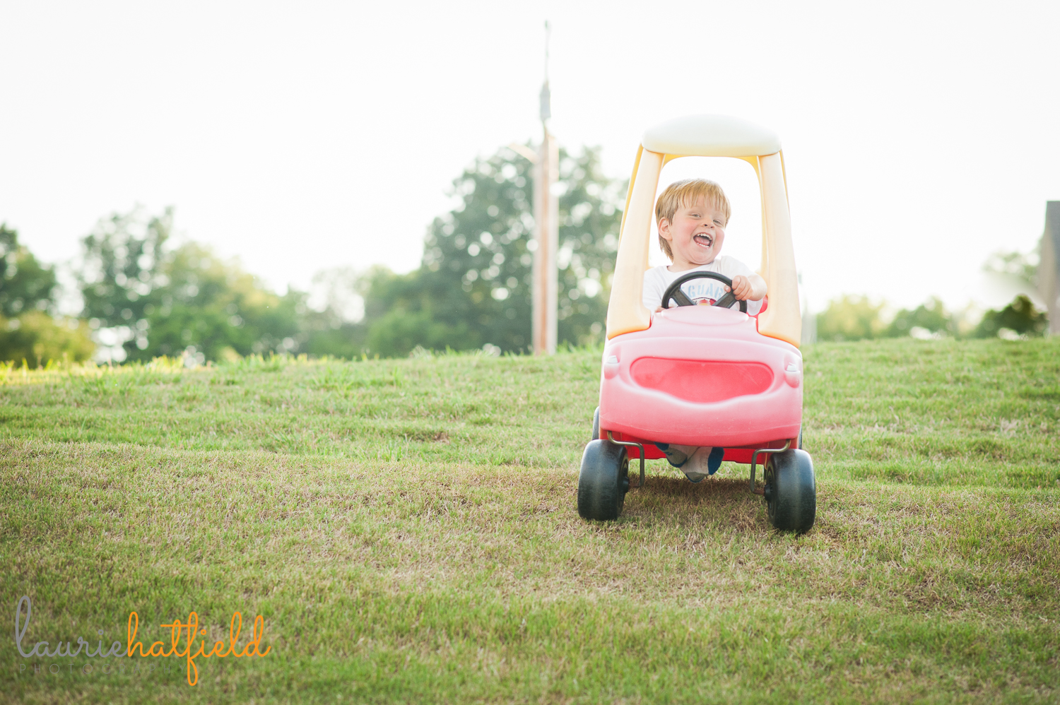 3-year-old riding Cozy Coupe | Huntsville family photographer