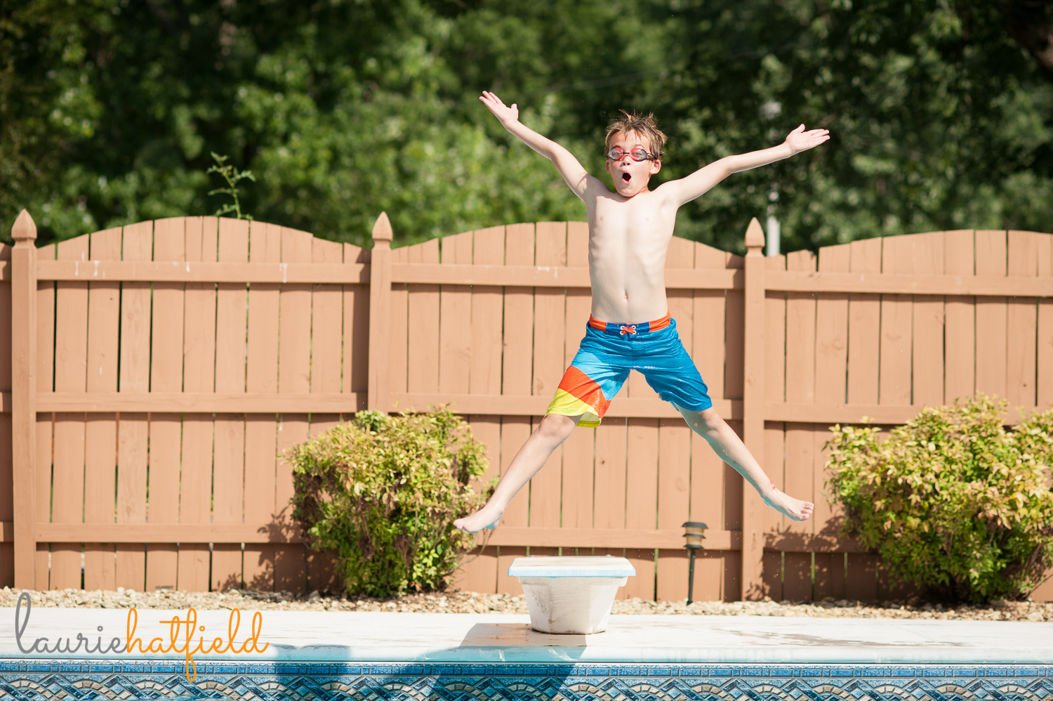boy jumping off diving board | Huntsville family photographer