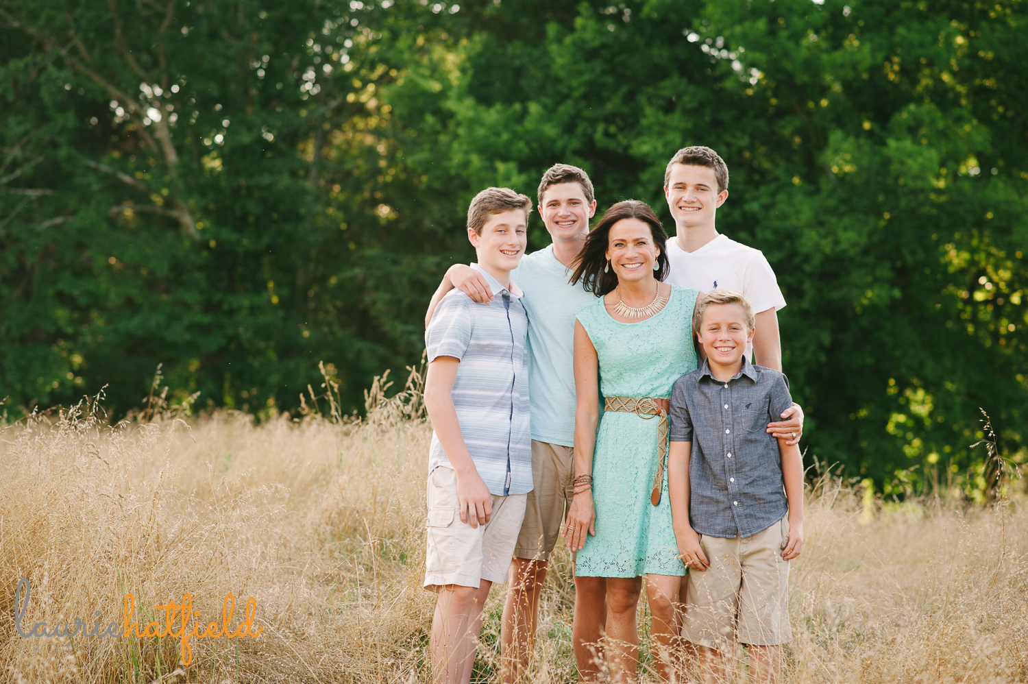 mom with four sons in field | Huntsville family photographer