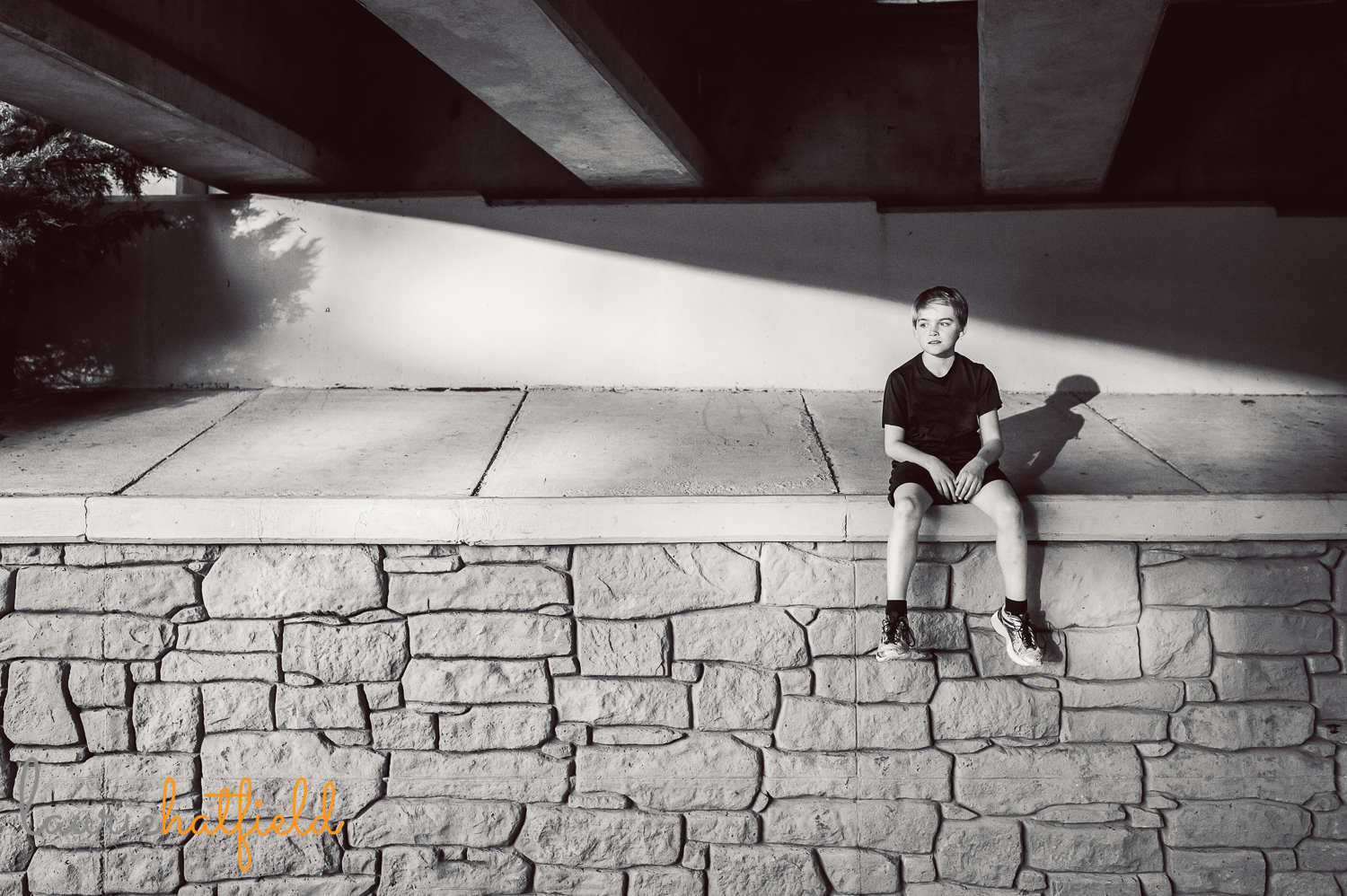 boy sitting on wall with shadow | Huntsville child photographer 