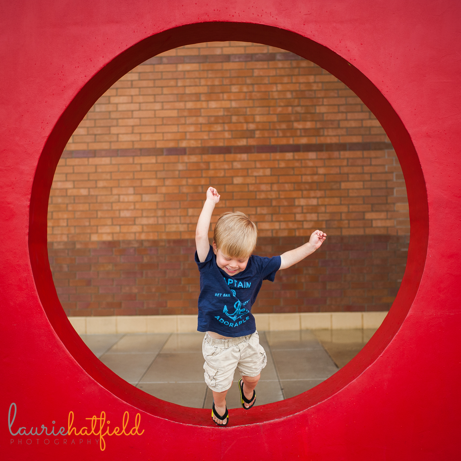 little boy jumping in red circle | Huntsville family photographer