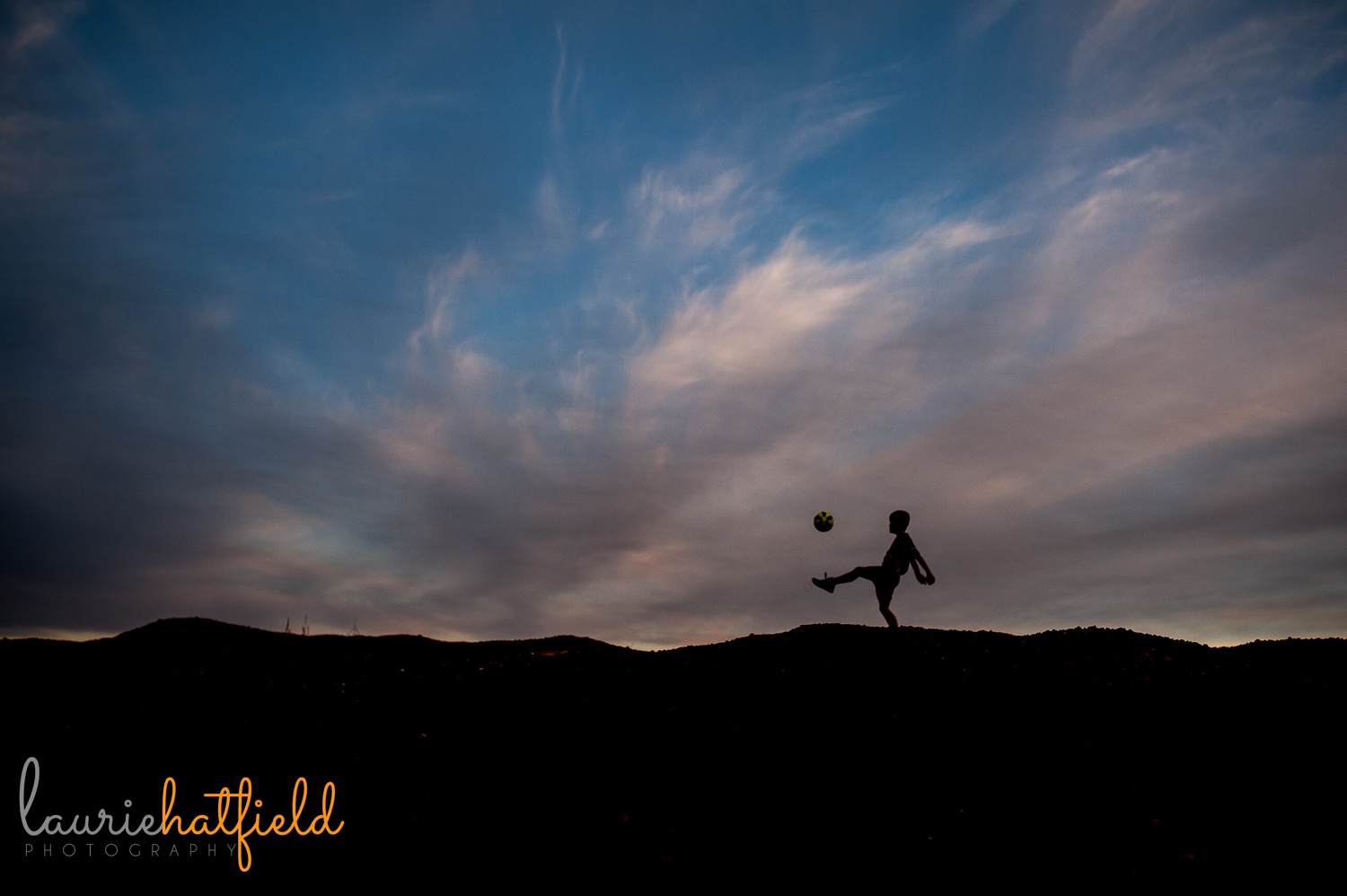 silhouette of boy and soccer ball | Huntsville family photographer