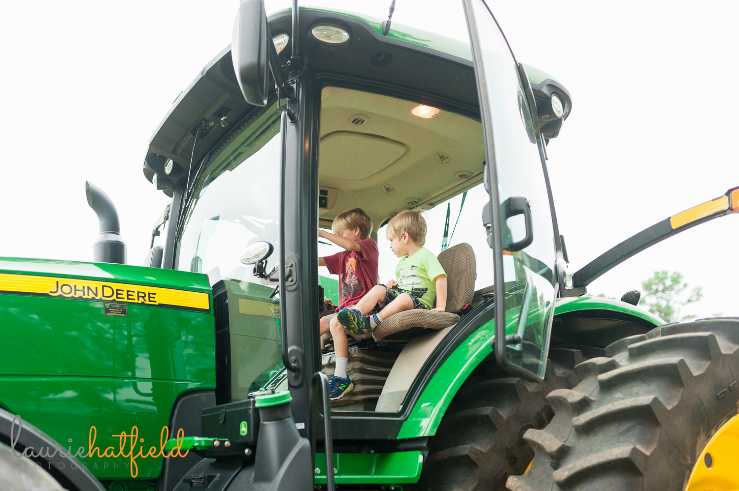 2 brothers sitting in tractor | Huntsville photographer