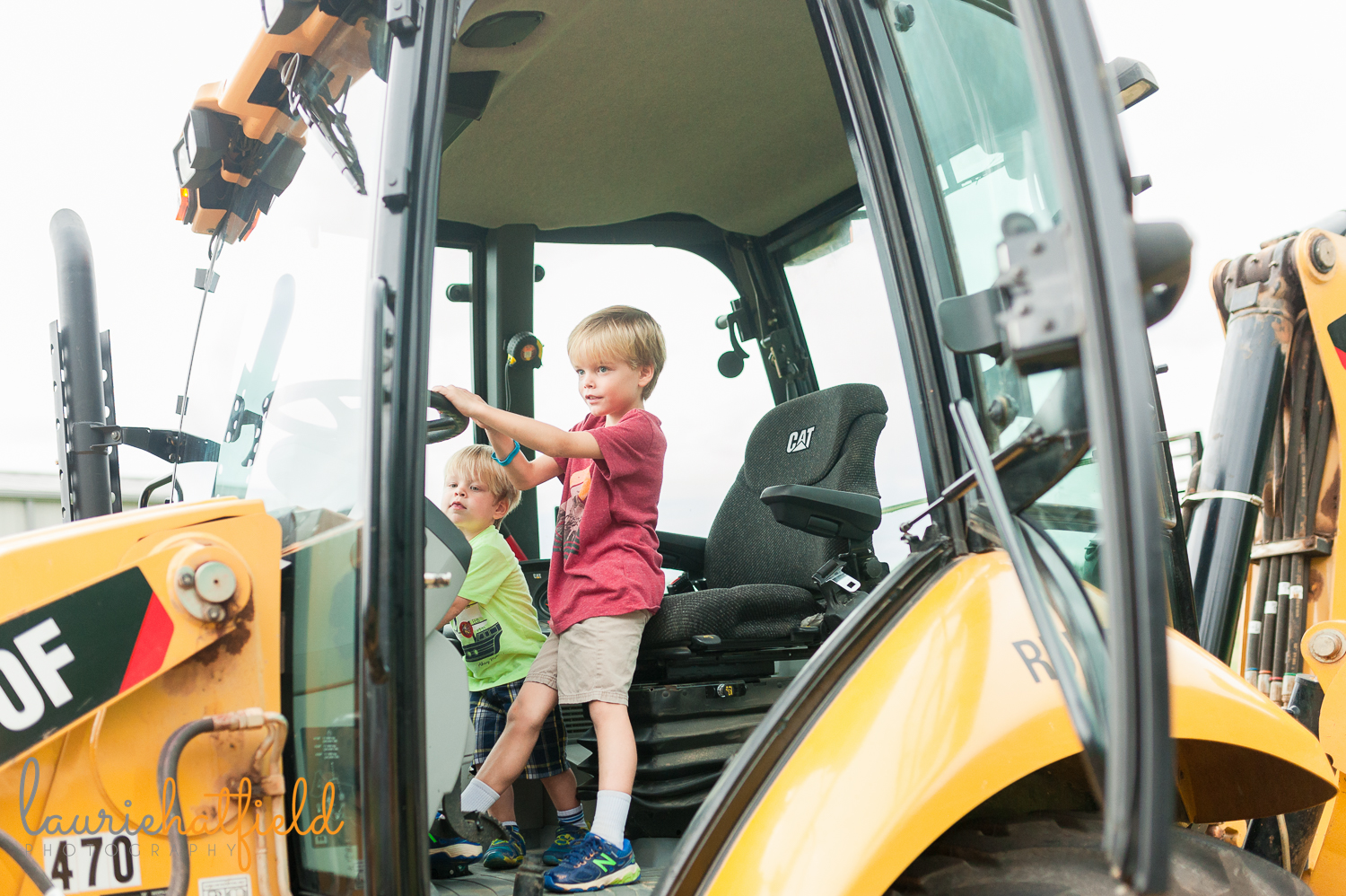 2 brothers sitting in cab of backhoe | Huntsville family photographer