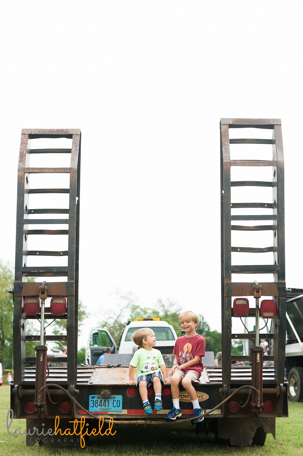 2 brothers sitting on tow truck | Huntsville family photographer 