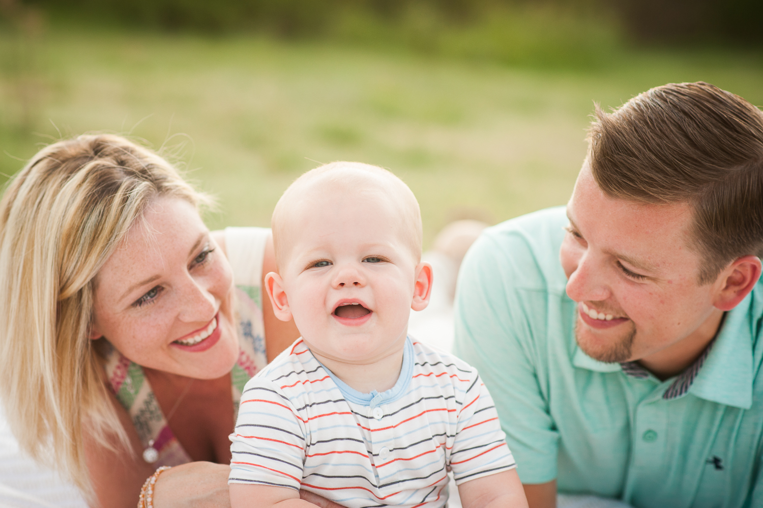 family of three in grass | Mobile lifestyle photographer