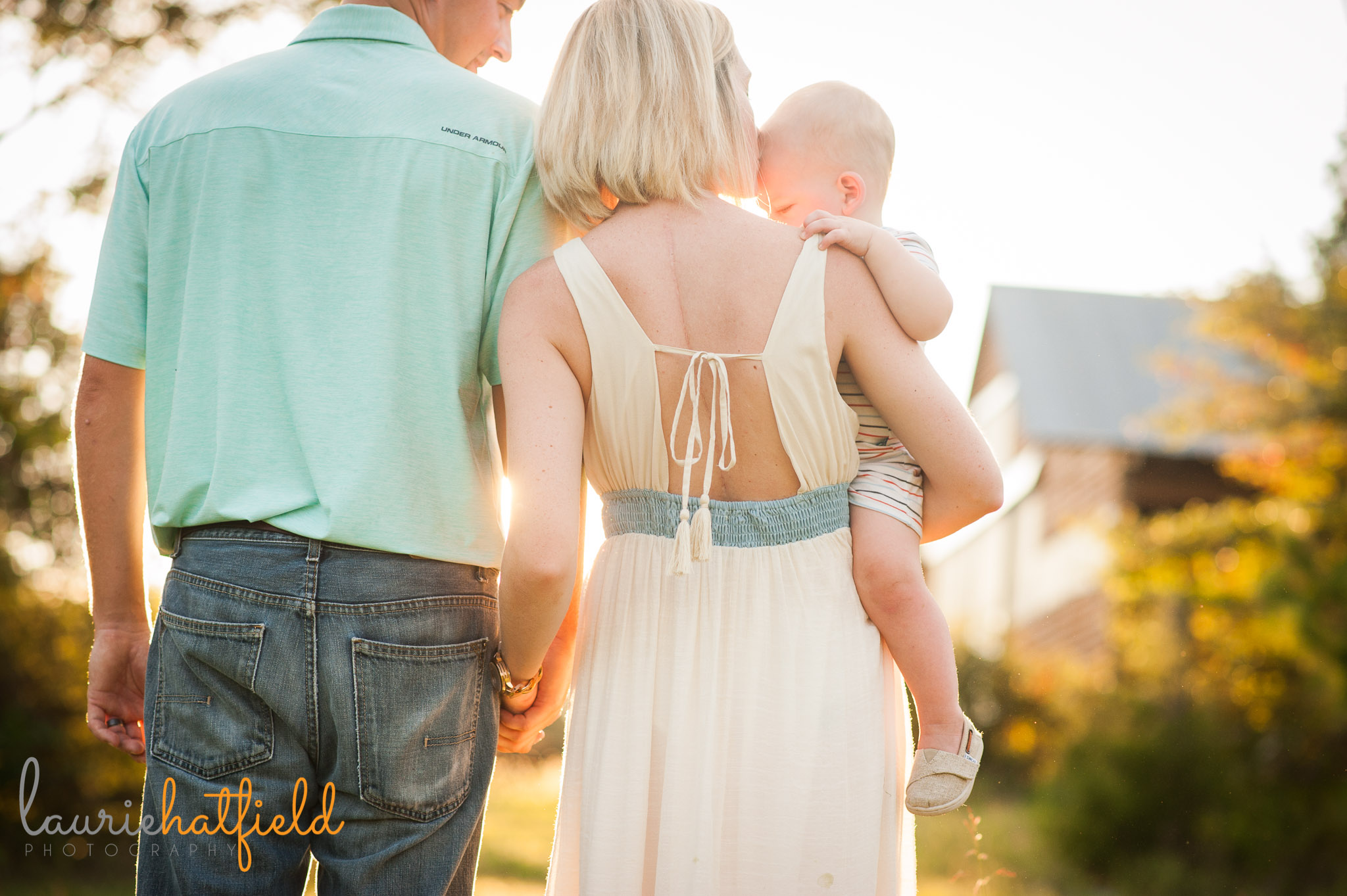 back of family of three in field | Mobile AL photographer