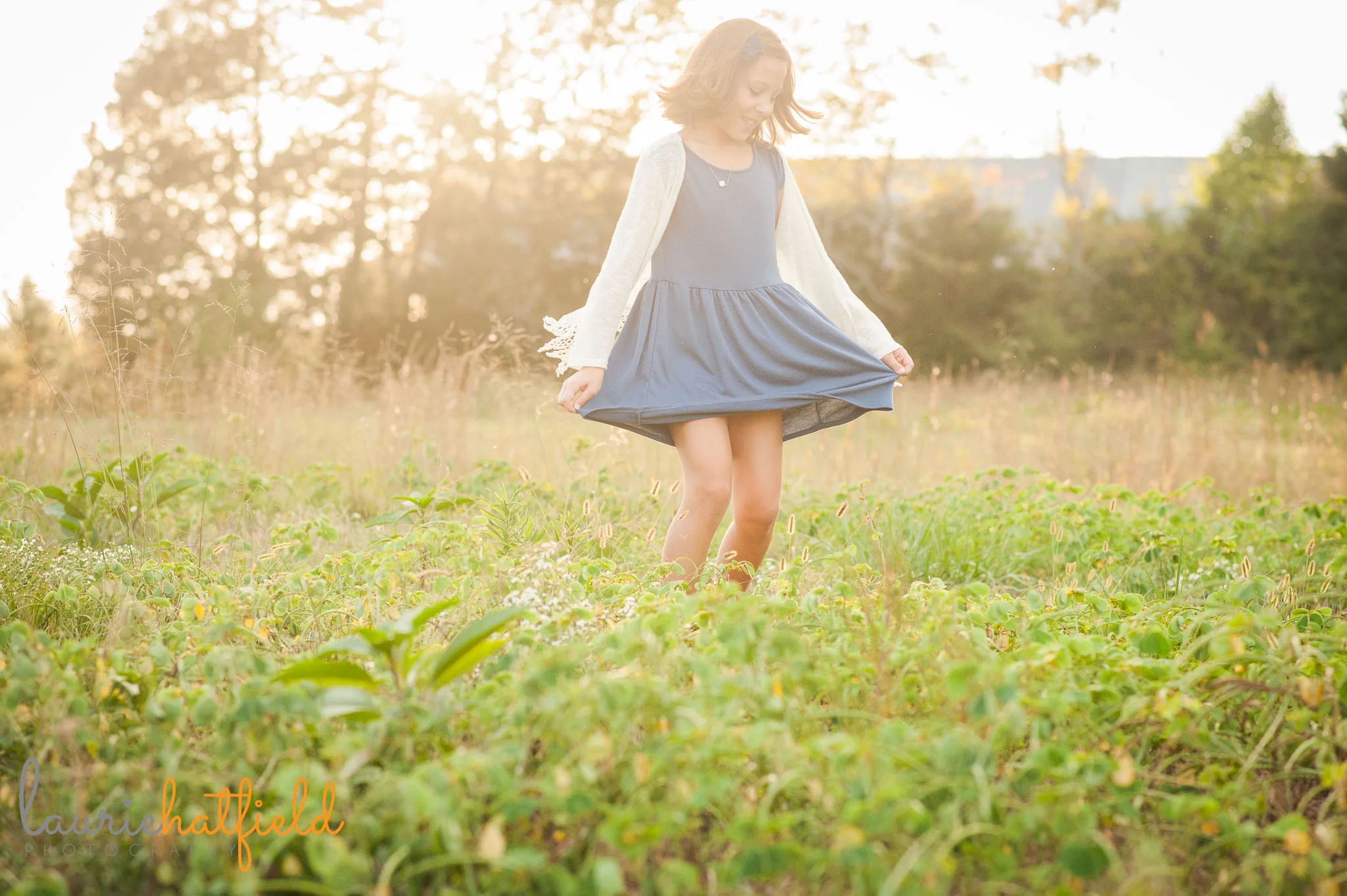 girl twirling in grass | Mobile family photographer