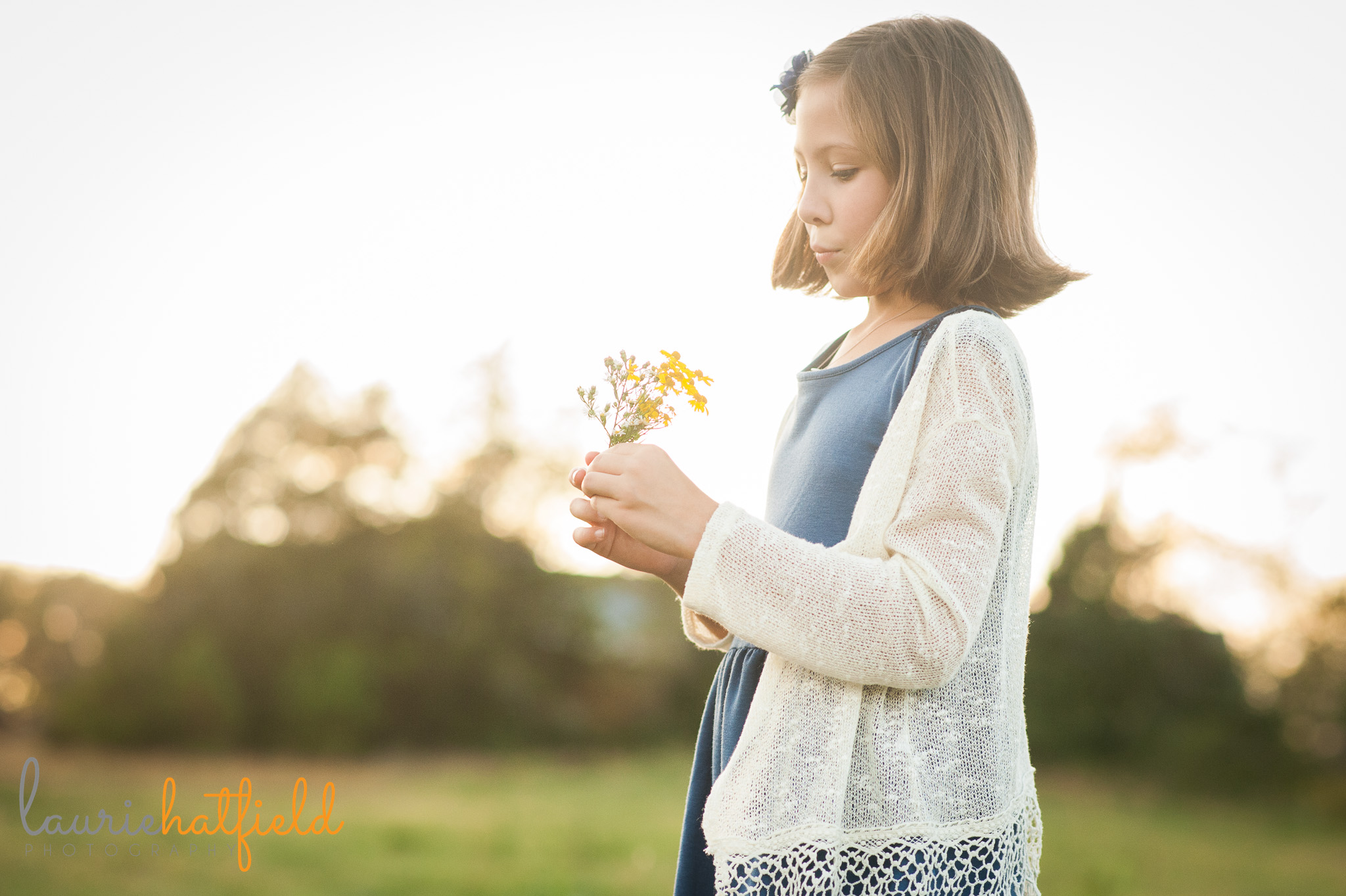 girl in blue dress holding yellow flower | Mobile family photographer