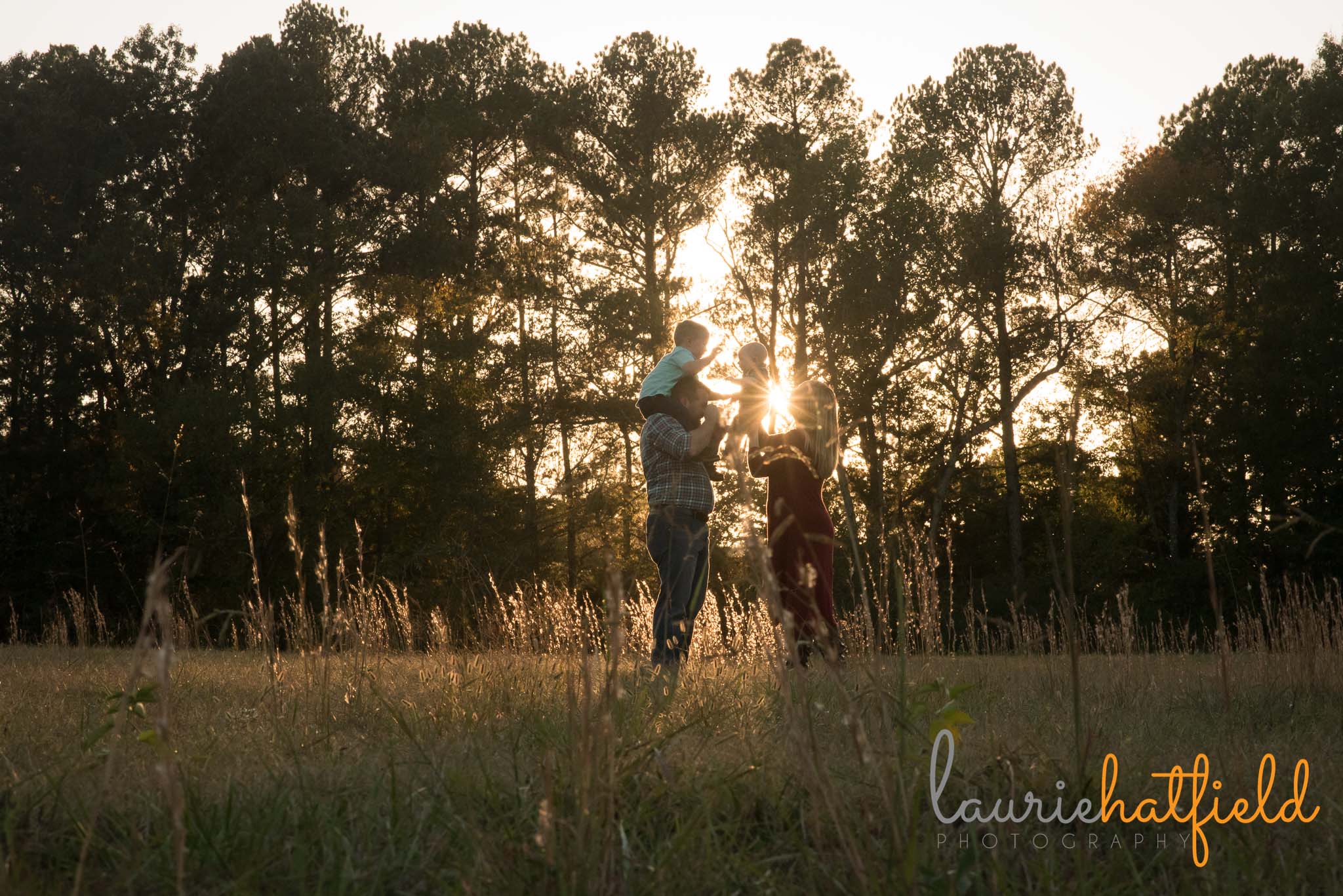 family of four walking through field | Mobile AL lifestyle photographer