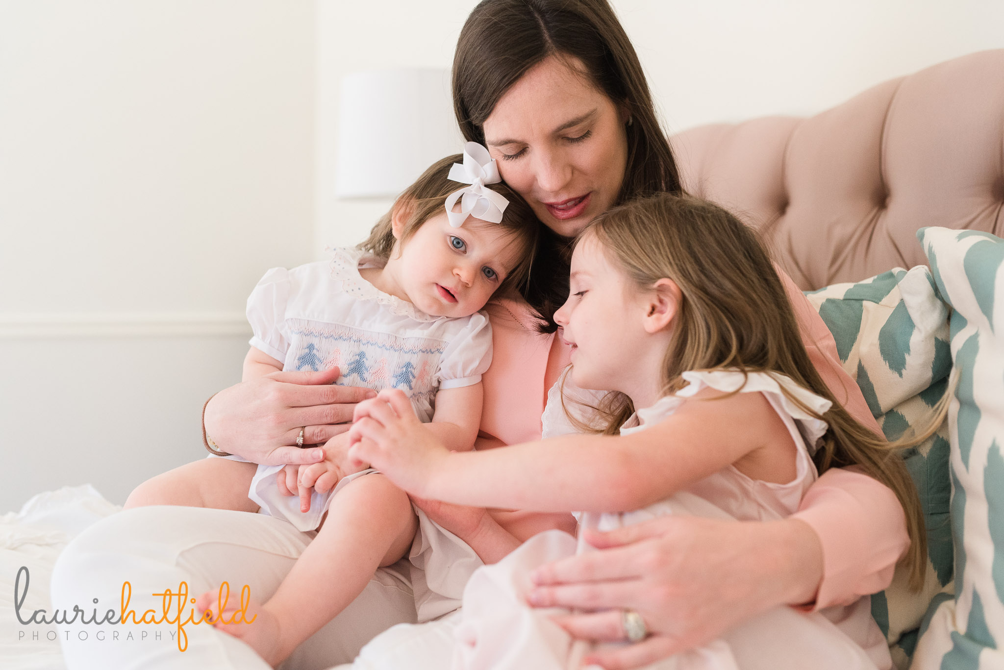 mom with 2 girls on bed | Mobile AL newborn photographer