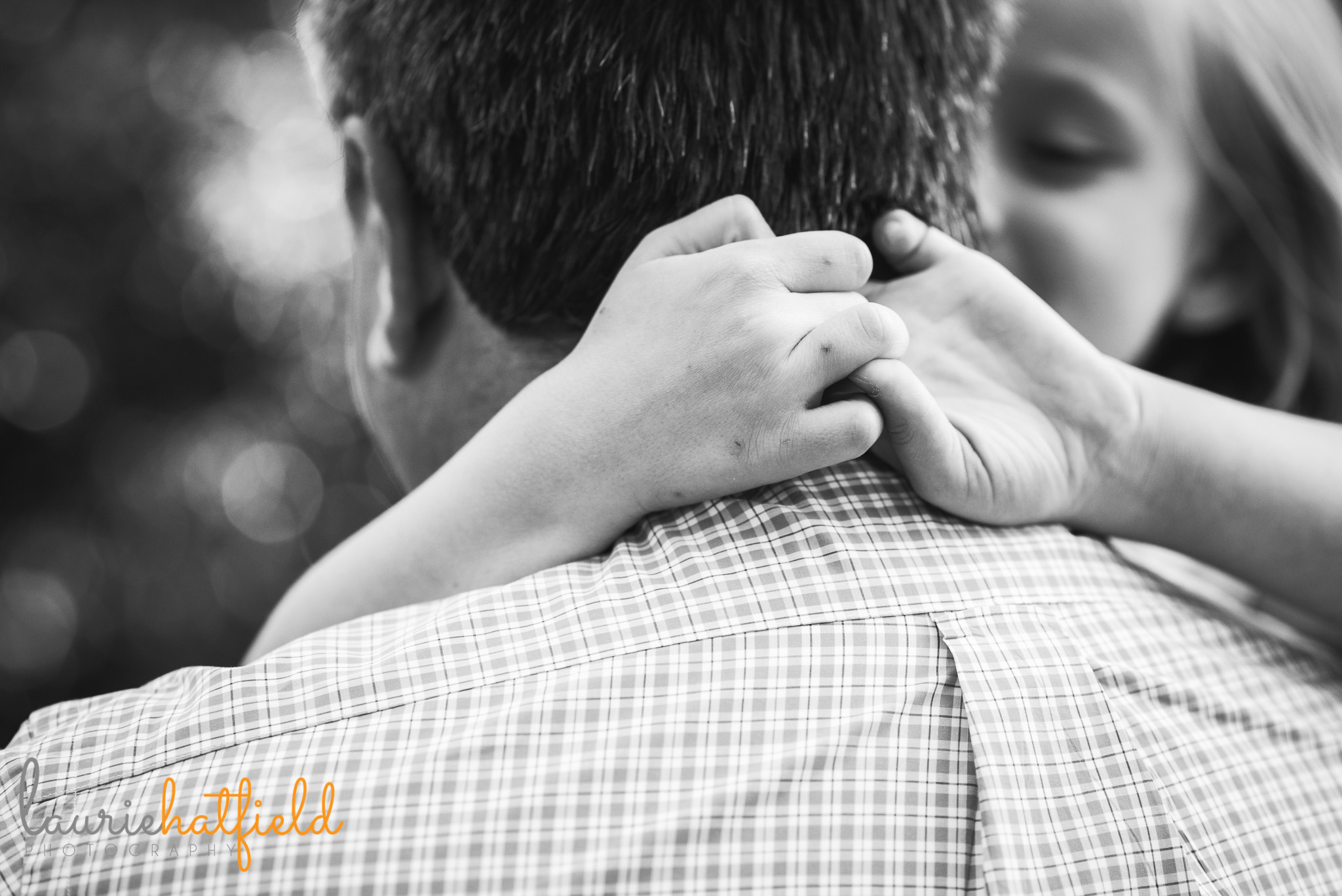 little girl holding onto Dad | Mobile AL family photographer Laurie Hatfield Photography