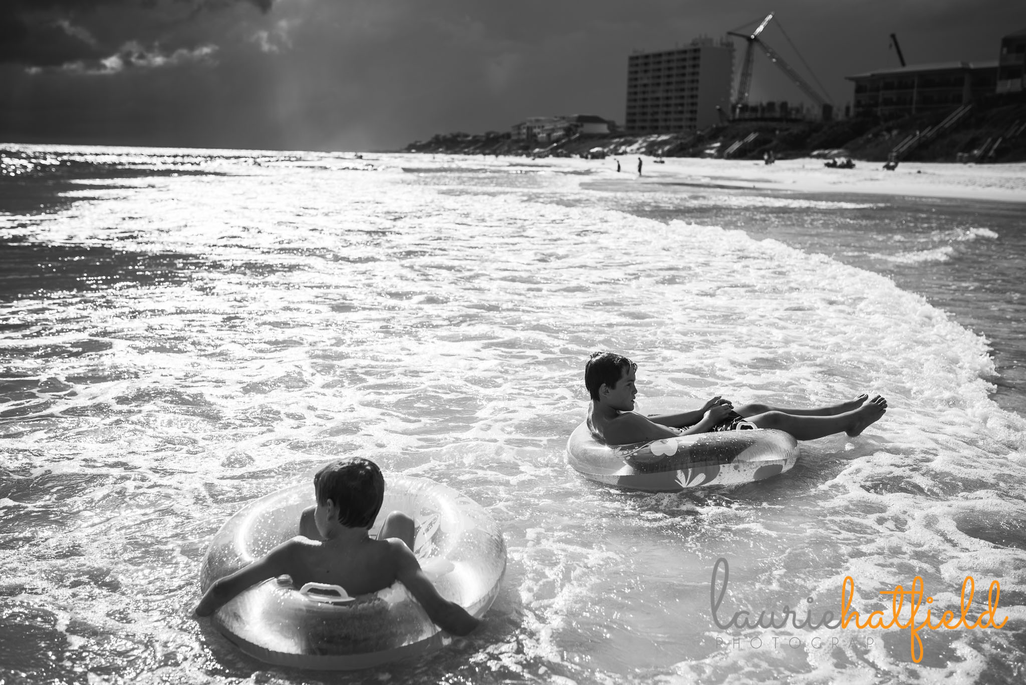 2 boys on floats on the beach | Mobile AL family photographer