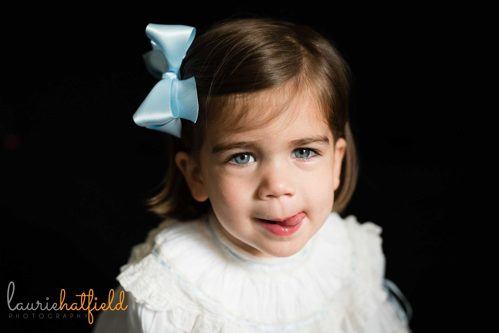little girl with tongue sticking out | Mobile AL preschool photographer