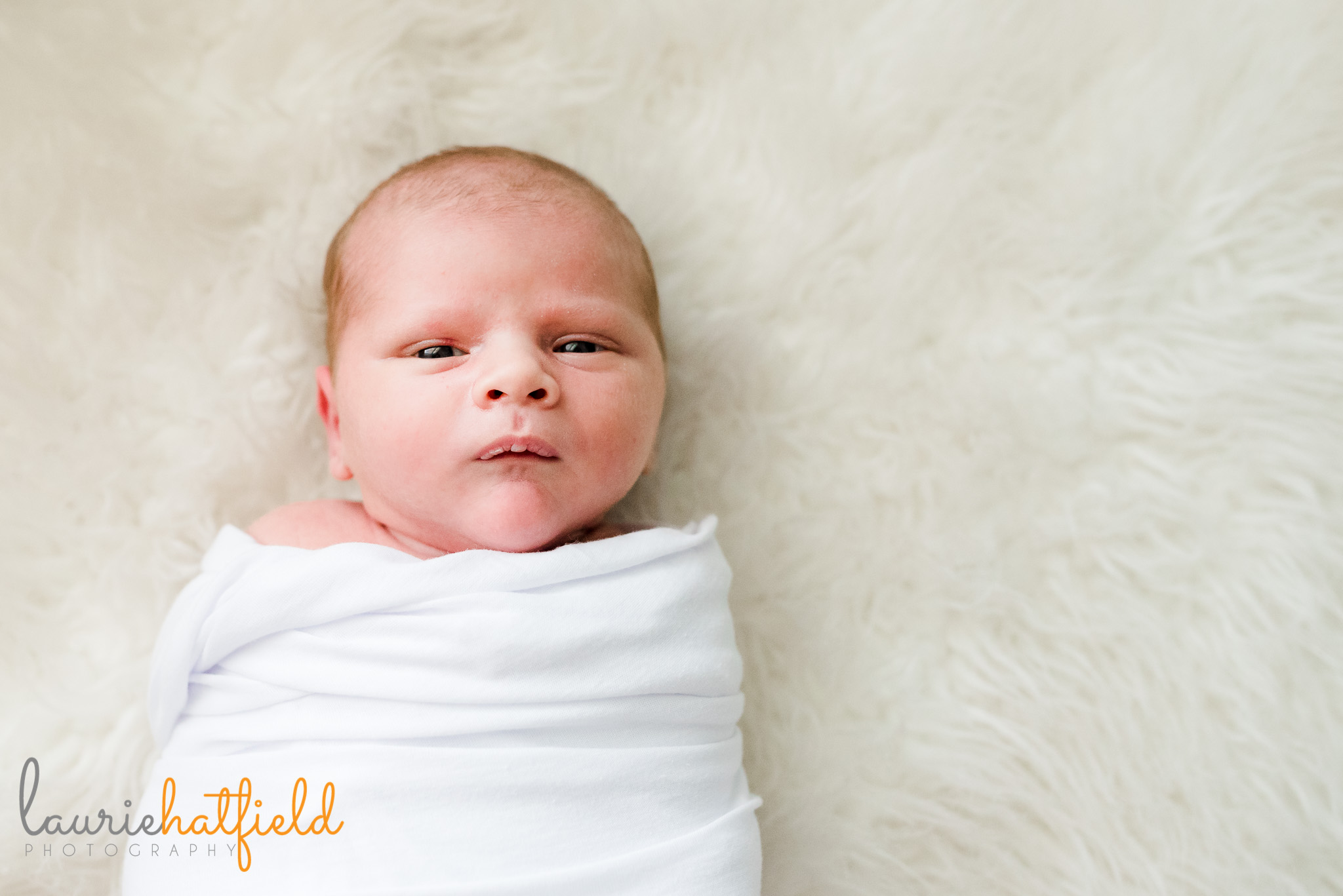 baby boy in white swaddle | Mobile AL newborn photographer