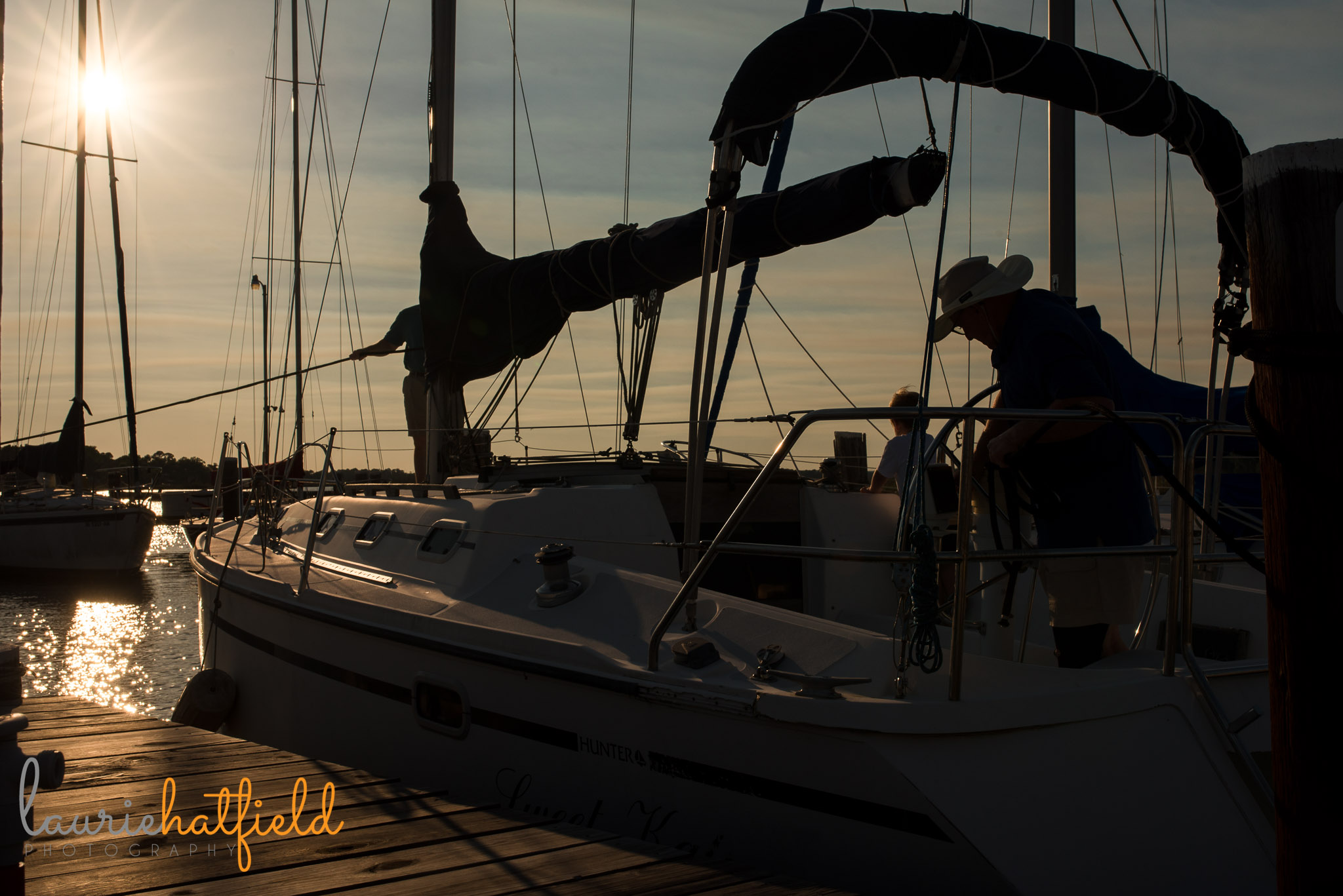 family on sailboat at sunset | Mobile AL photographer