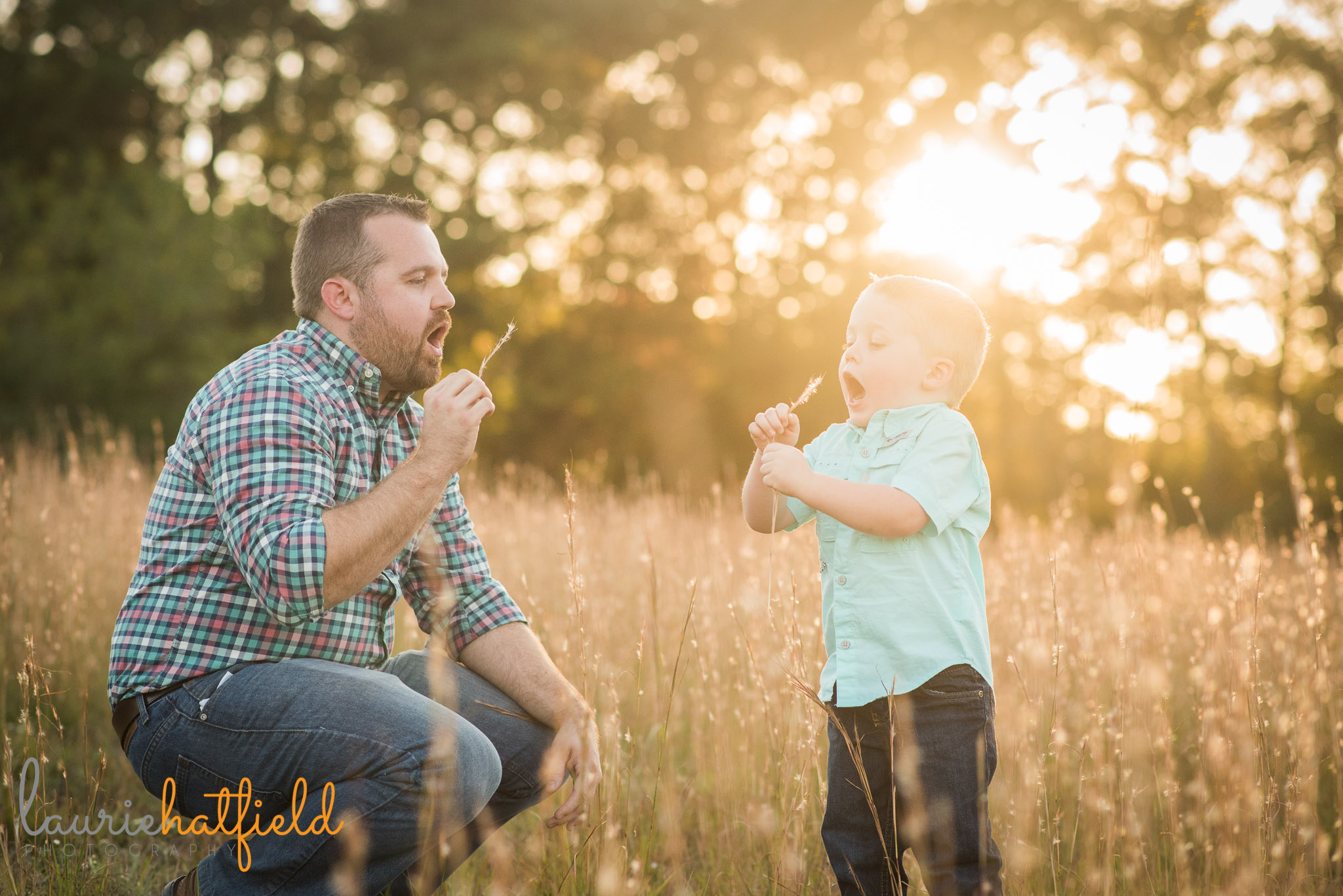 dad and son blowing dandelions in a field | Mobile AL lifestyle photographer