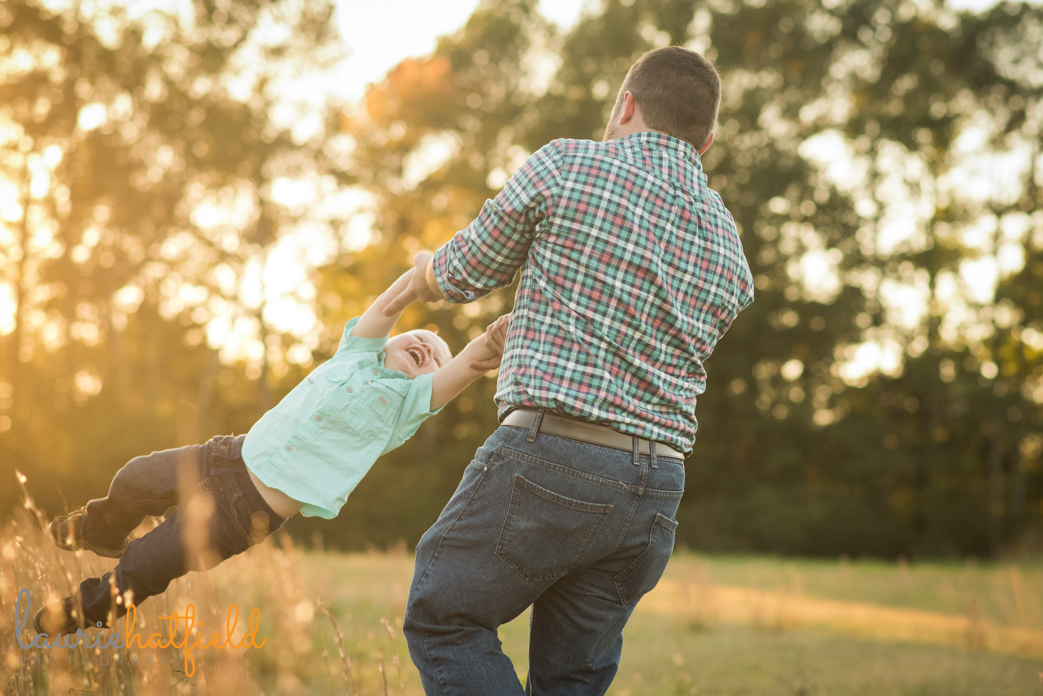dad spinning little boy | Mobile AL family lifestyle photographer