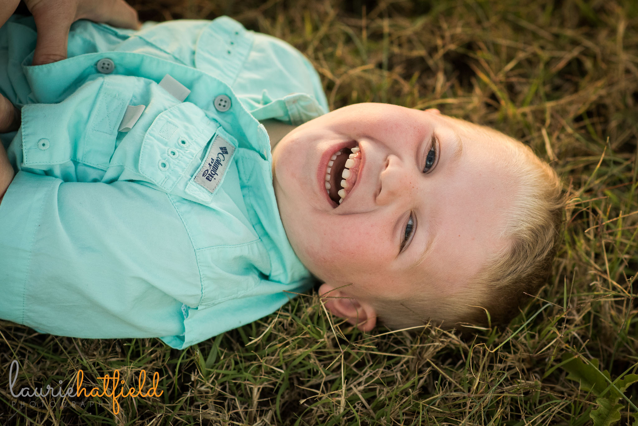 3-year-old boy laughing in grass | Mobile AL lifestyle family photographer