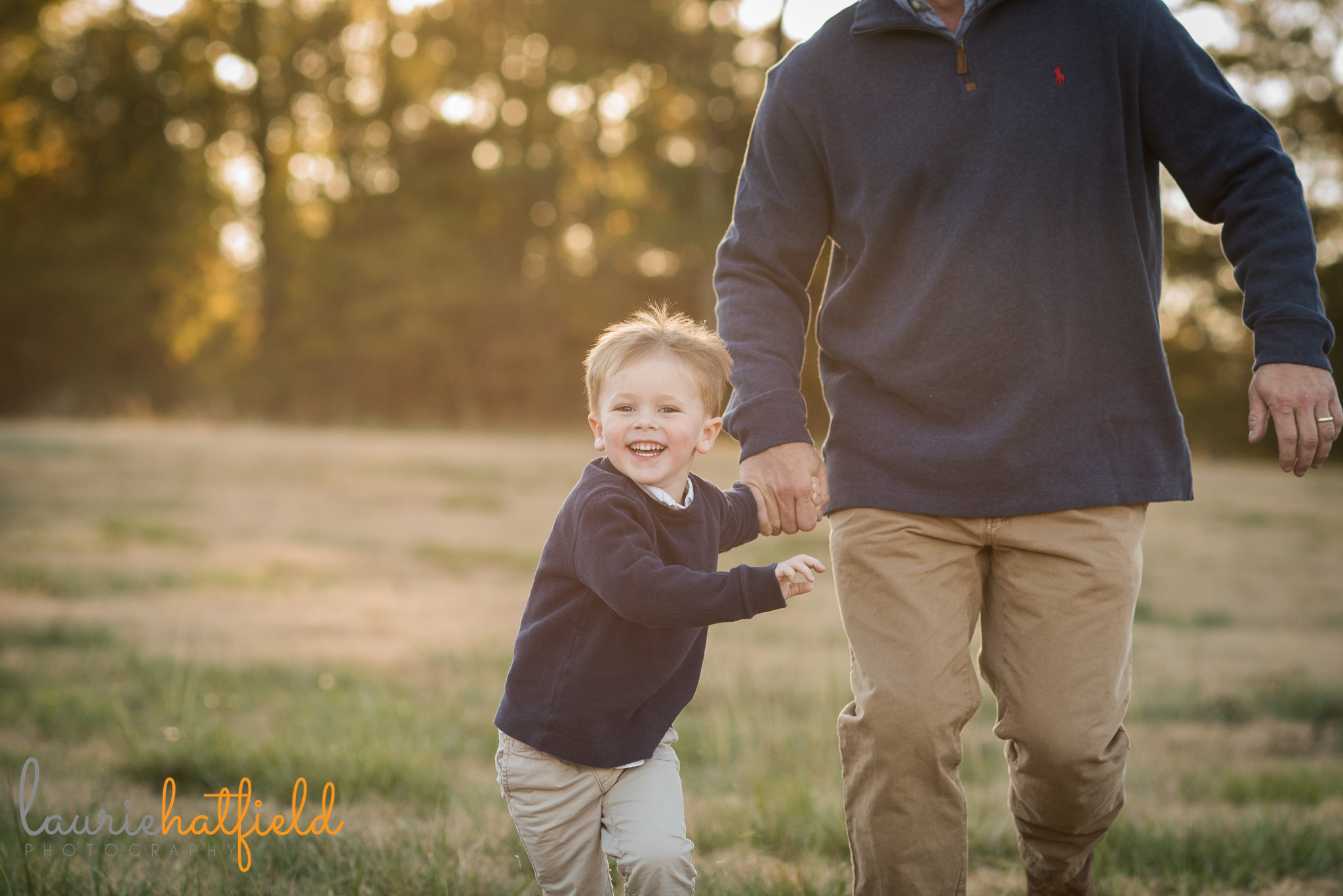 3-year-old boy running with dad in field | Mobile AL family photographer
