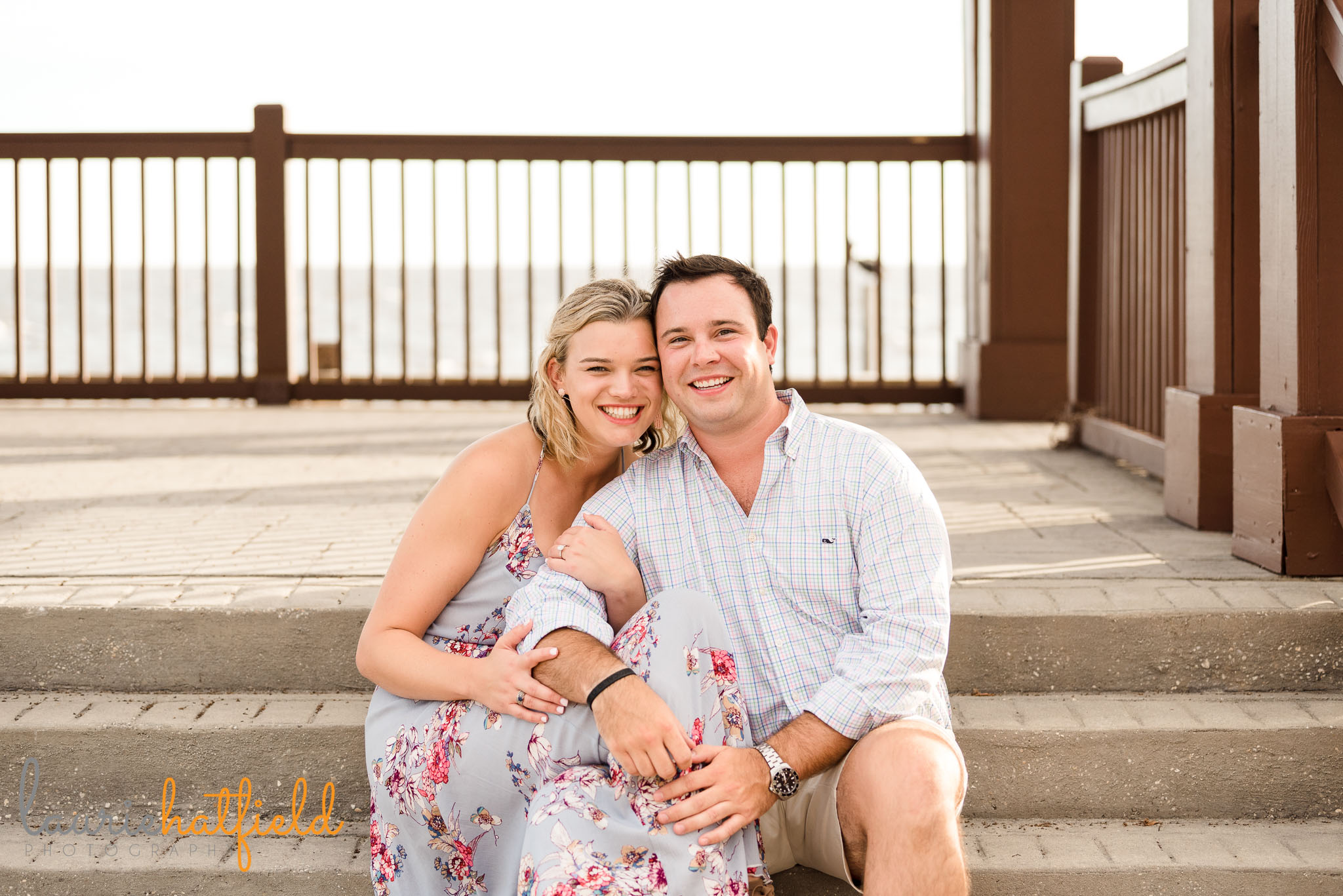 couple sitting together after engagement | Mobile AL proposal photographer